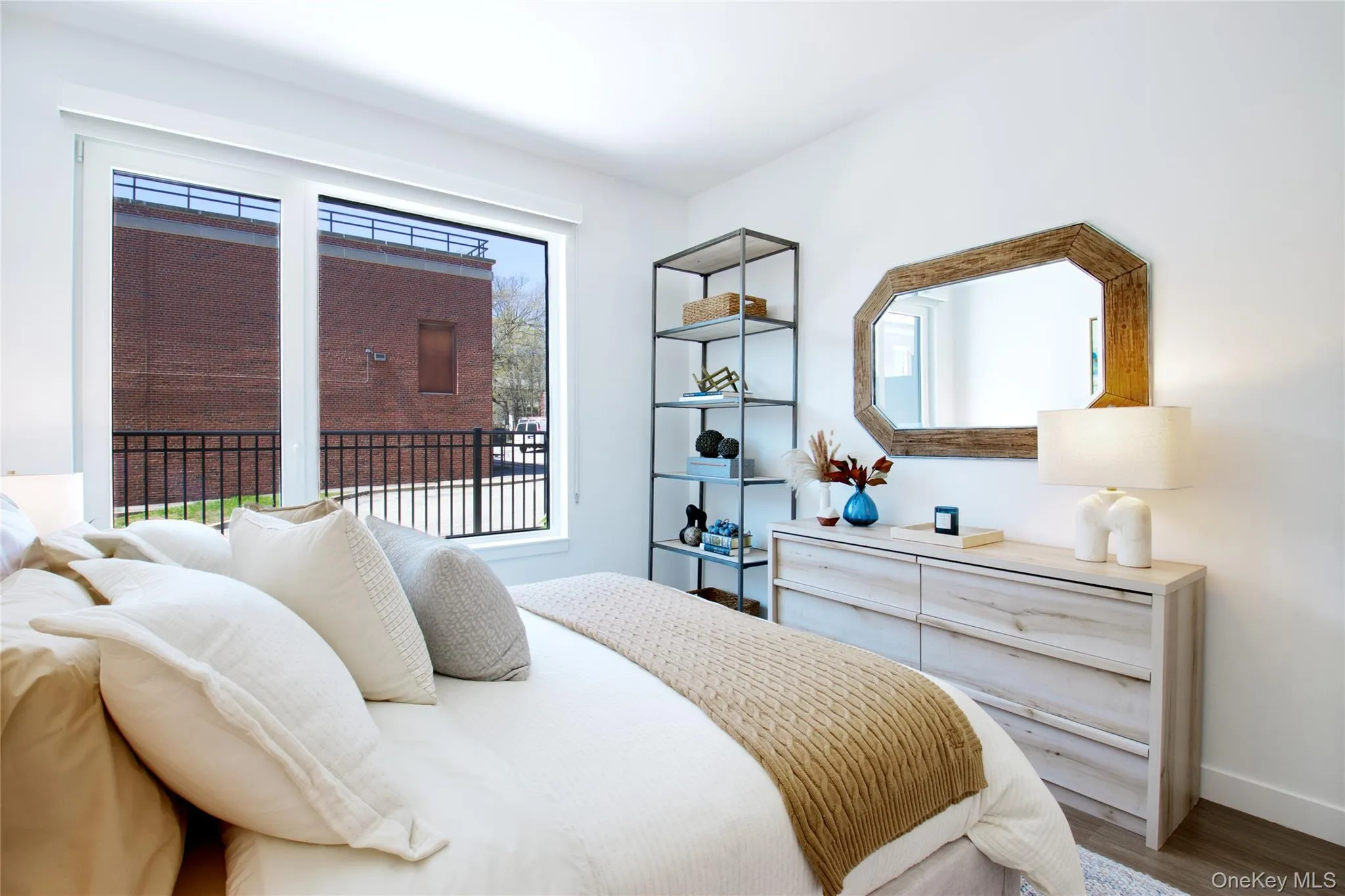 Bedroom featuring wood finished floors and baseboards Bedroom featuring wood finished floors and baseboards