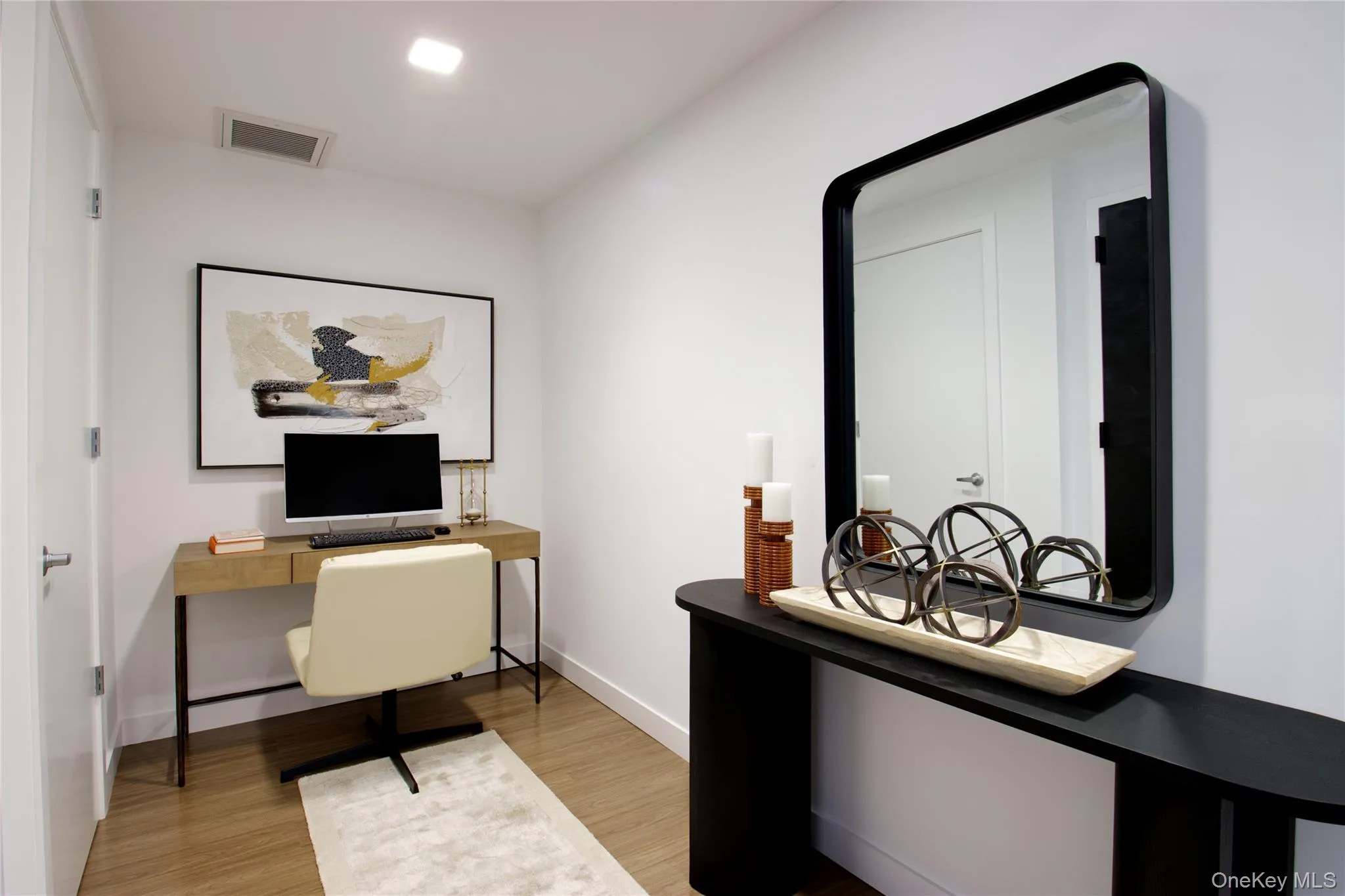 Office area featuring light wood-style floors and baseboards Office area featuring light wood-style floors and baseboards