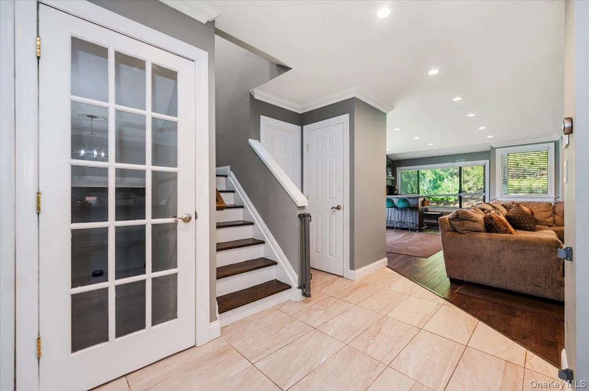 Tiled entry with guest closets. Open directly onto living room. Tiled entry with guest closets. Open directly onto living room.