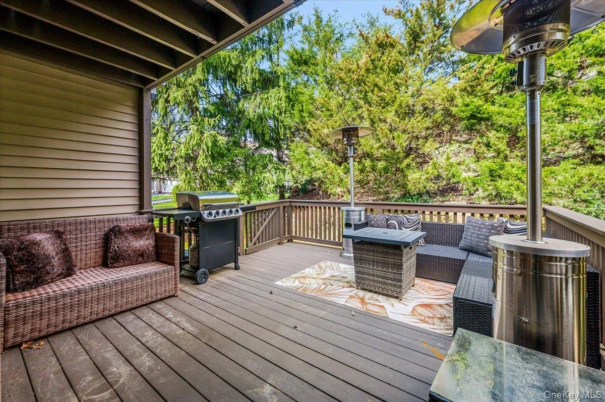 Deck featuring area for grilling and outdoor lounge area Deck featuring area for grilling and outdoor lounge area
