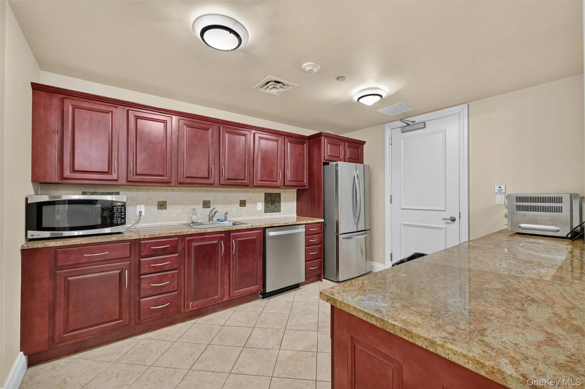 Entertaining space complete with kitchen. Entertaining space complete with kitchen.