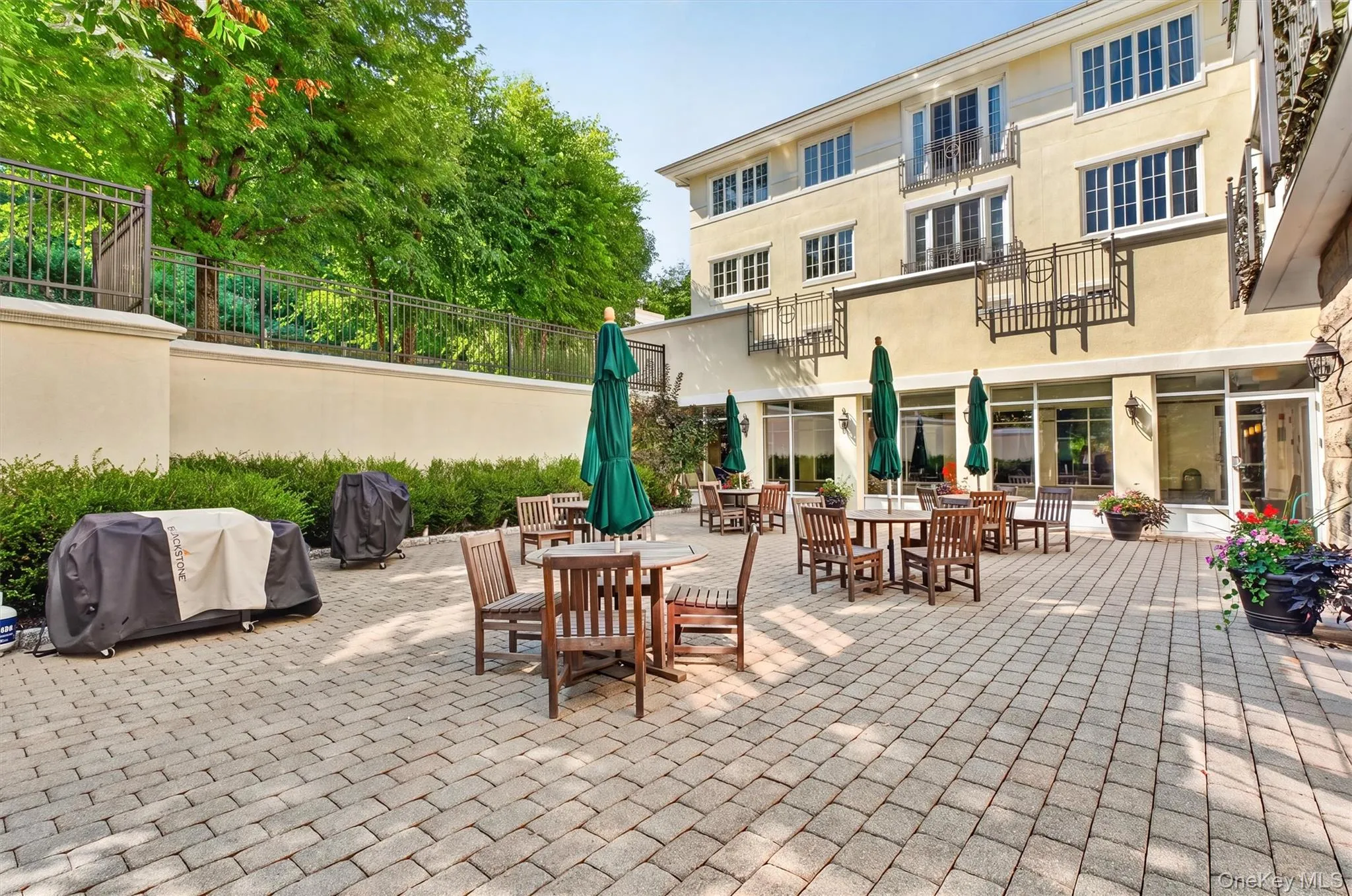Outdoor gathering area with barbecue grills and comfortable seating. Outdoor gathering area with barbecue grills and comfortable seating.