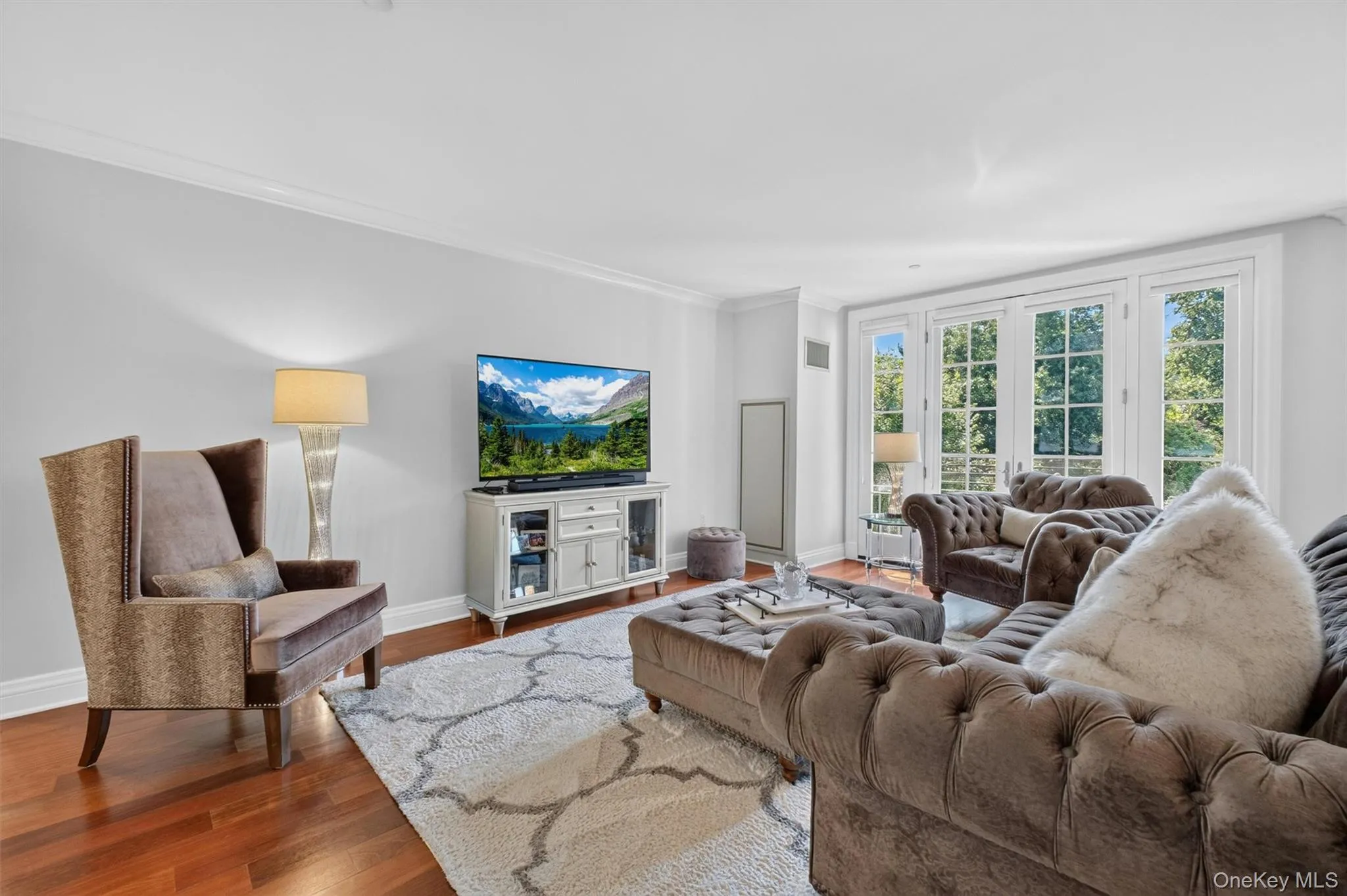 Beautiful Living Room with a Juliette balcony filling the space with natural light & wooded views. Beautiful Living Room with a Juliette balcony filling the space with natural light & wooded views.