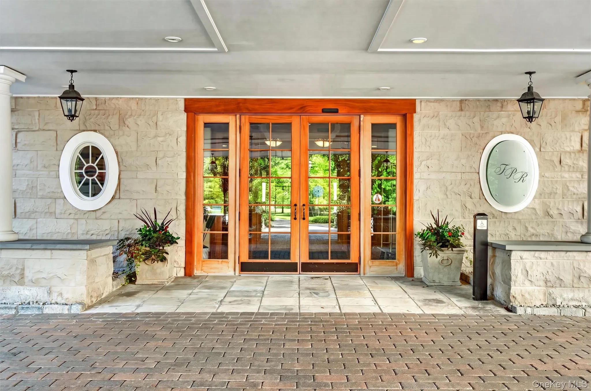 Elegant wood framed doors and stone entranceway. Elegant wood framed doors and stone entranceway.