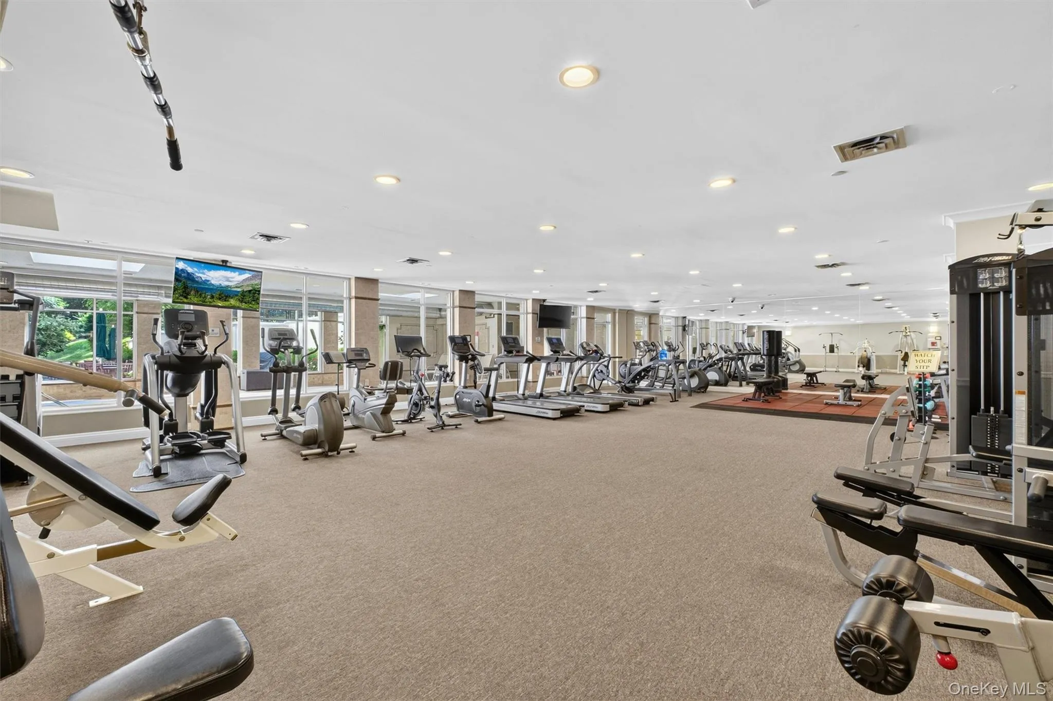 Expansive fitness center with everything you need for a complete workout. Expansive fitness center with everything you need for a complete workout.