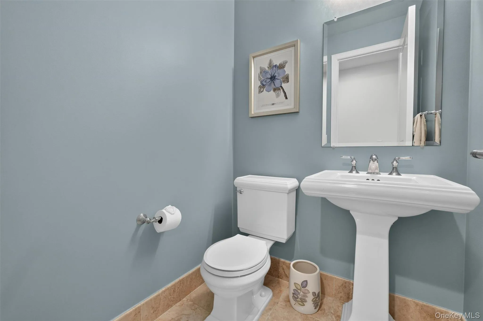 Chic Powder Room with stylish fixtures & finishes. Chic Powder Room with stylish fixtures & finishes.