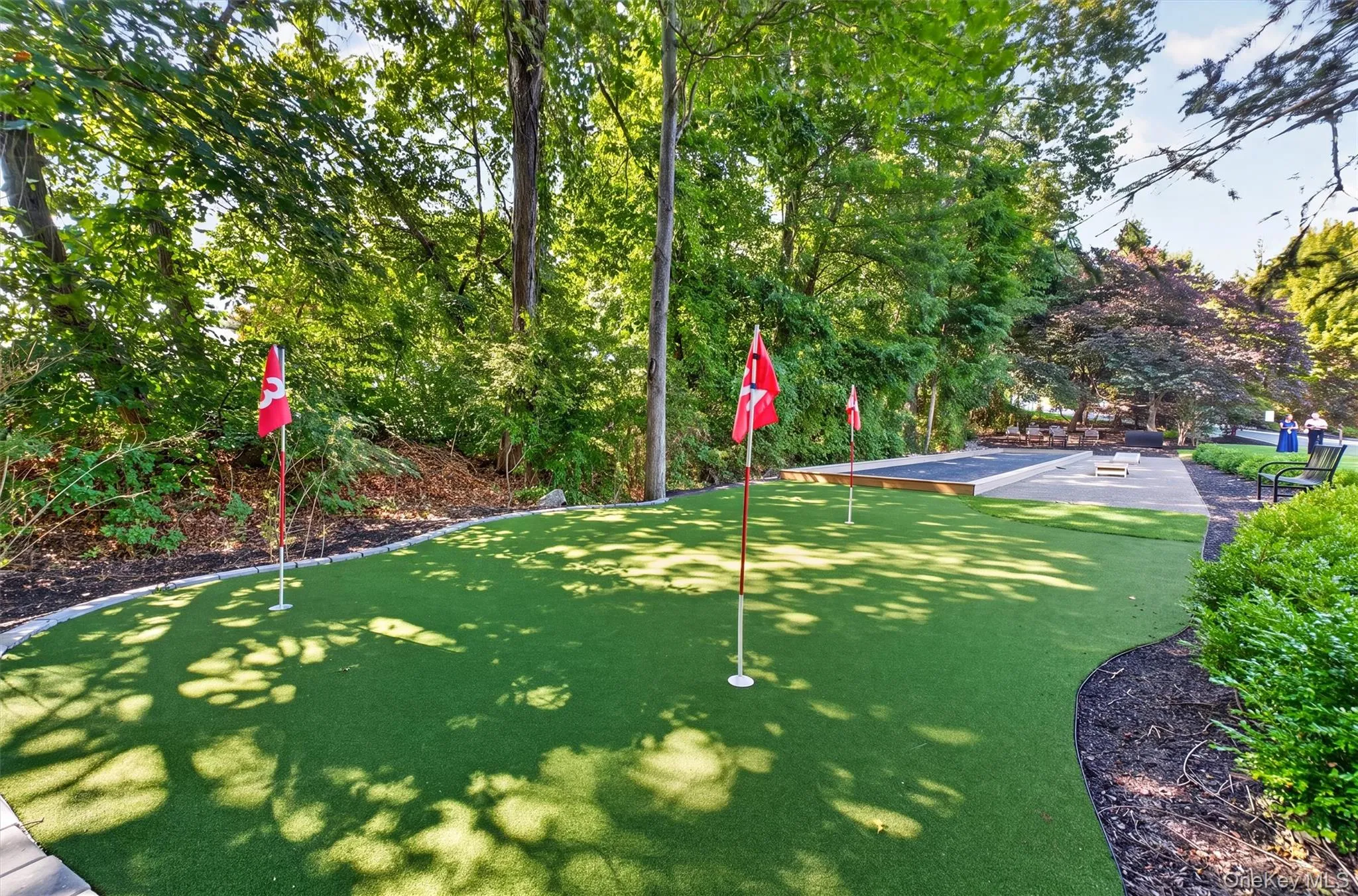 Putting green and bocce ball court perfect for friendly competition. Putting green and bocce ball court perfect for friendly competition.