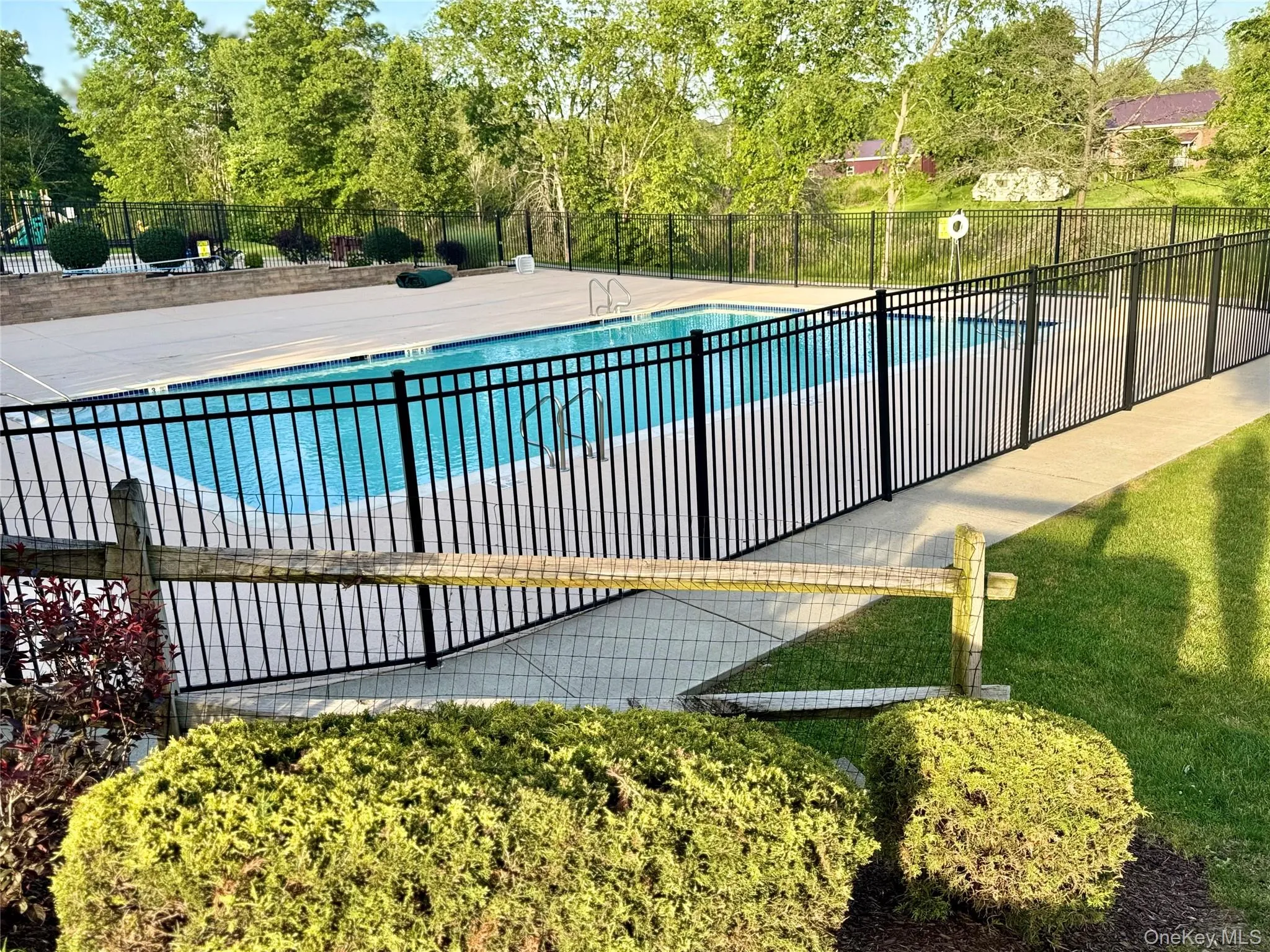 Community pool with view of scattered trees Community pool with view of scattered trees