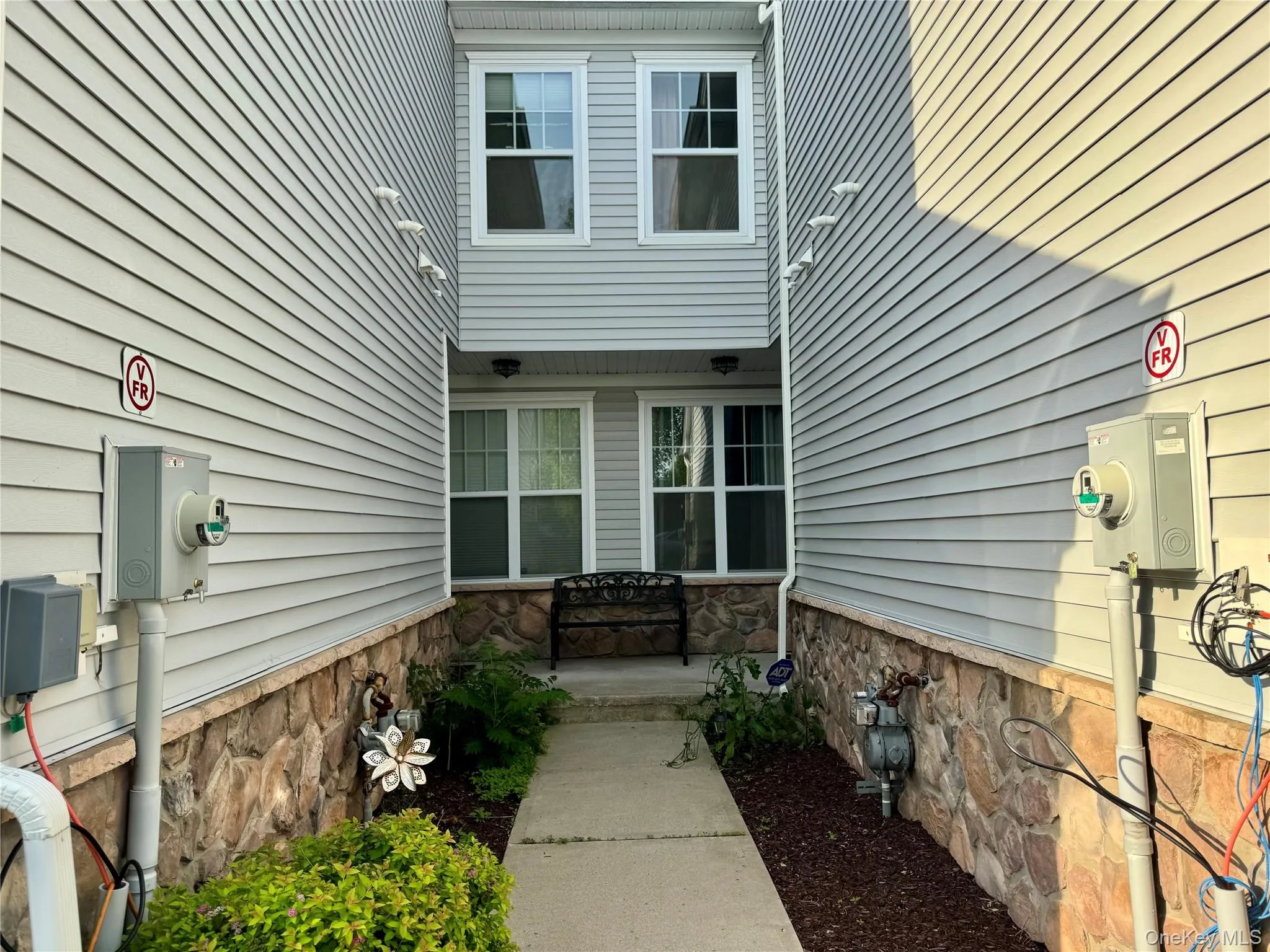 Property entrance featuring stone siding Property entrance featuring stone siding