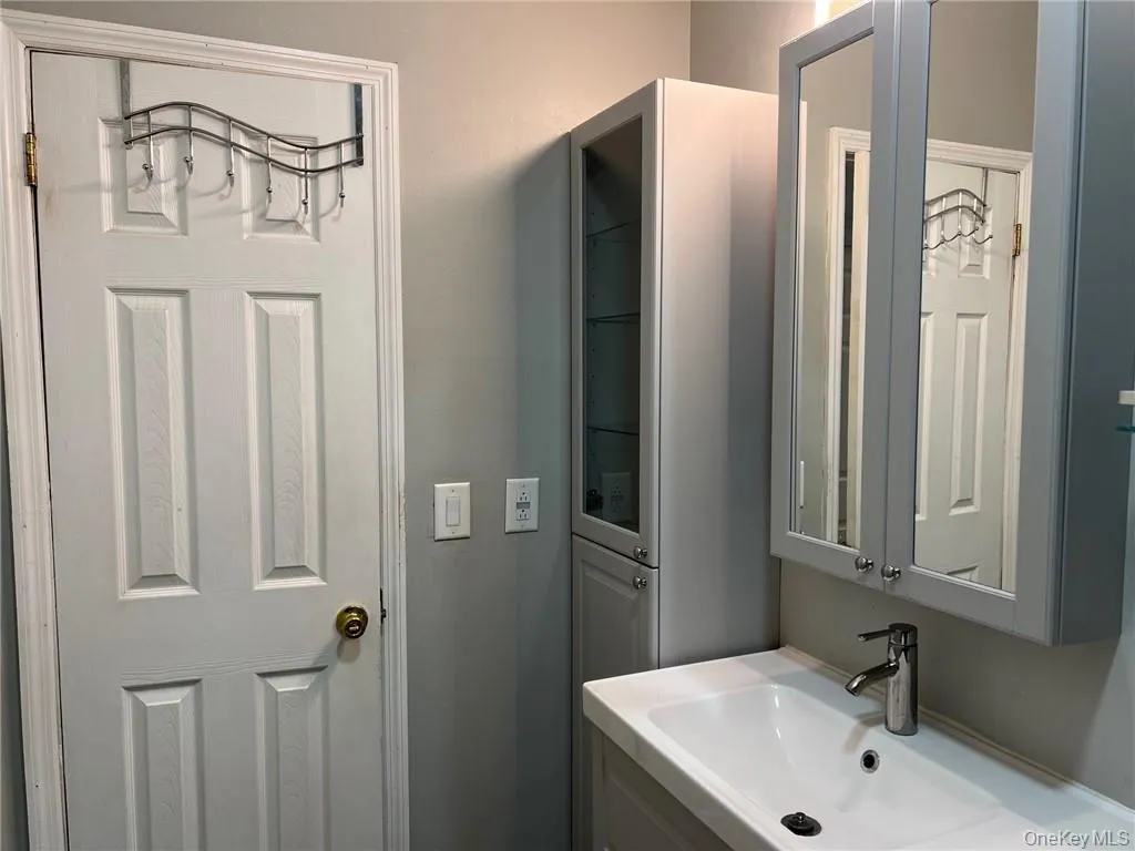 Bathroom featuring vanity Bathroom featuring vanity