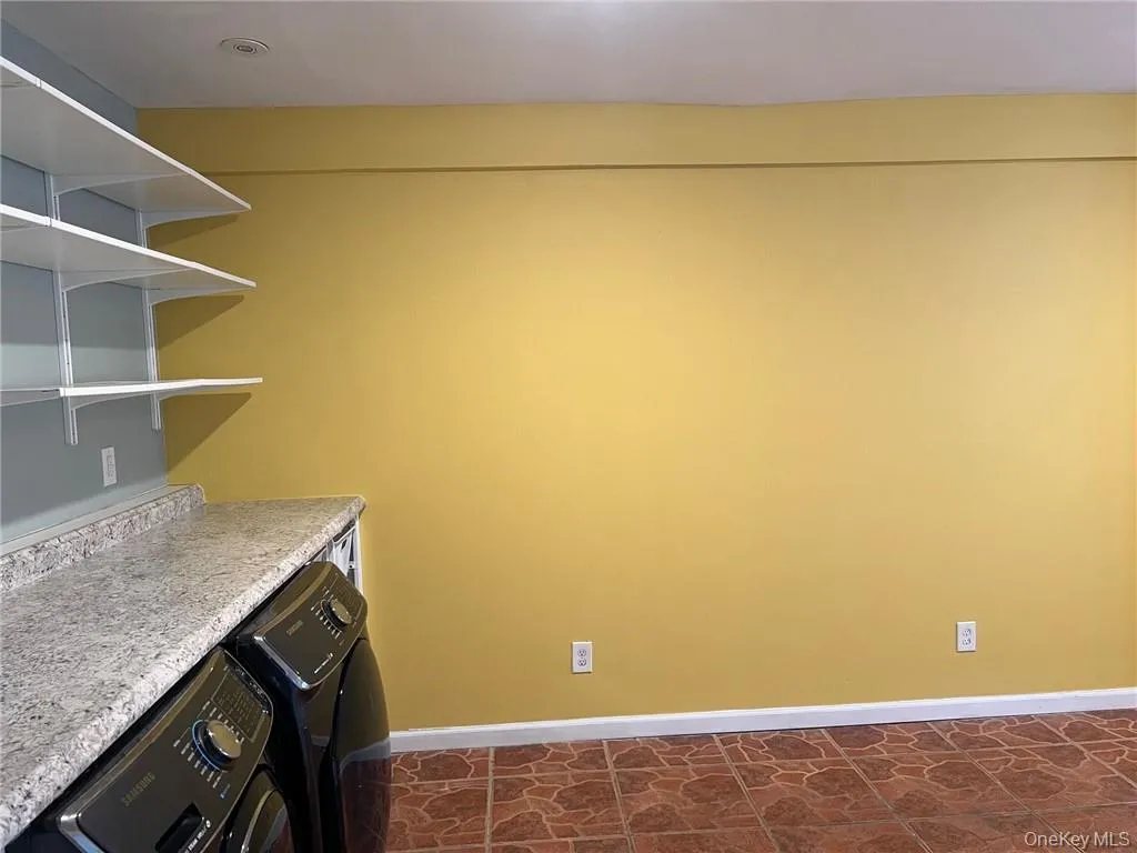 Laundry room featuring washer / dryer with additional space Laundry room featuring washer / dryer with additional space