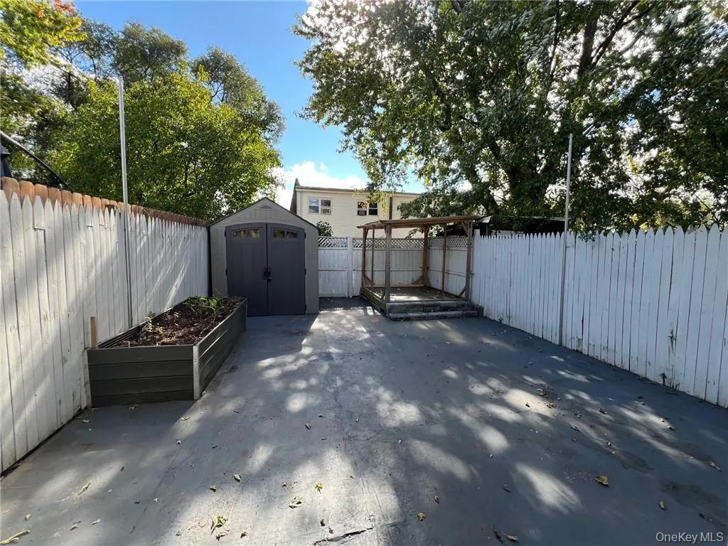View of patio / terrace featuring a storage unit View of patio / terrace featuring a storage unit