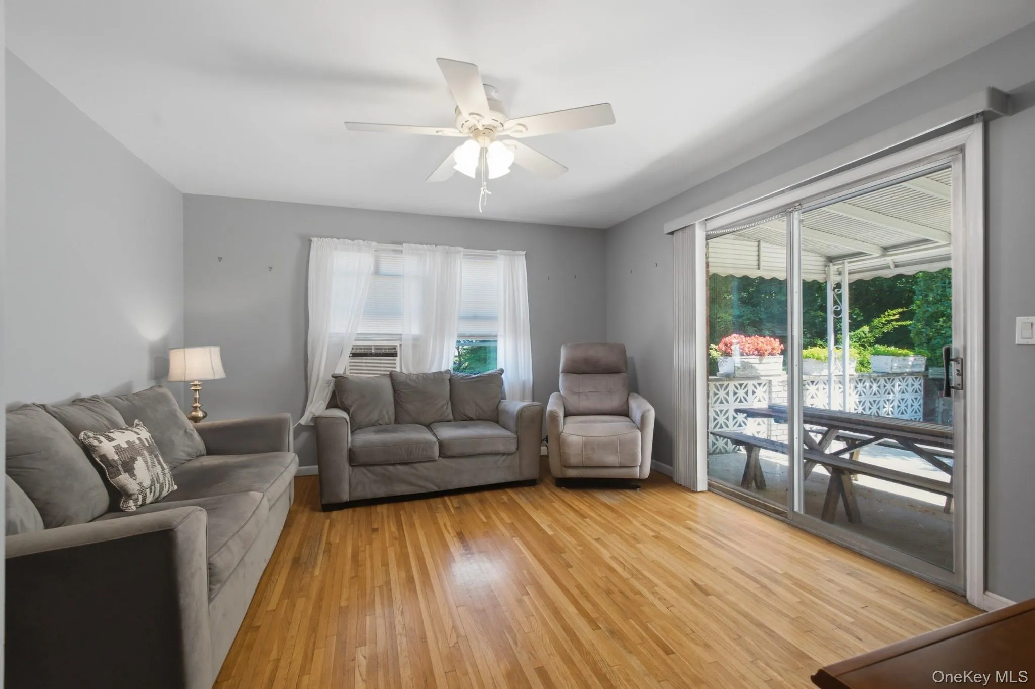 Light-filled den with sliding glass doors leading to the outdoor patio. Light-filled den with sliding glass doors leading to the outdoor patio.