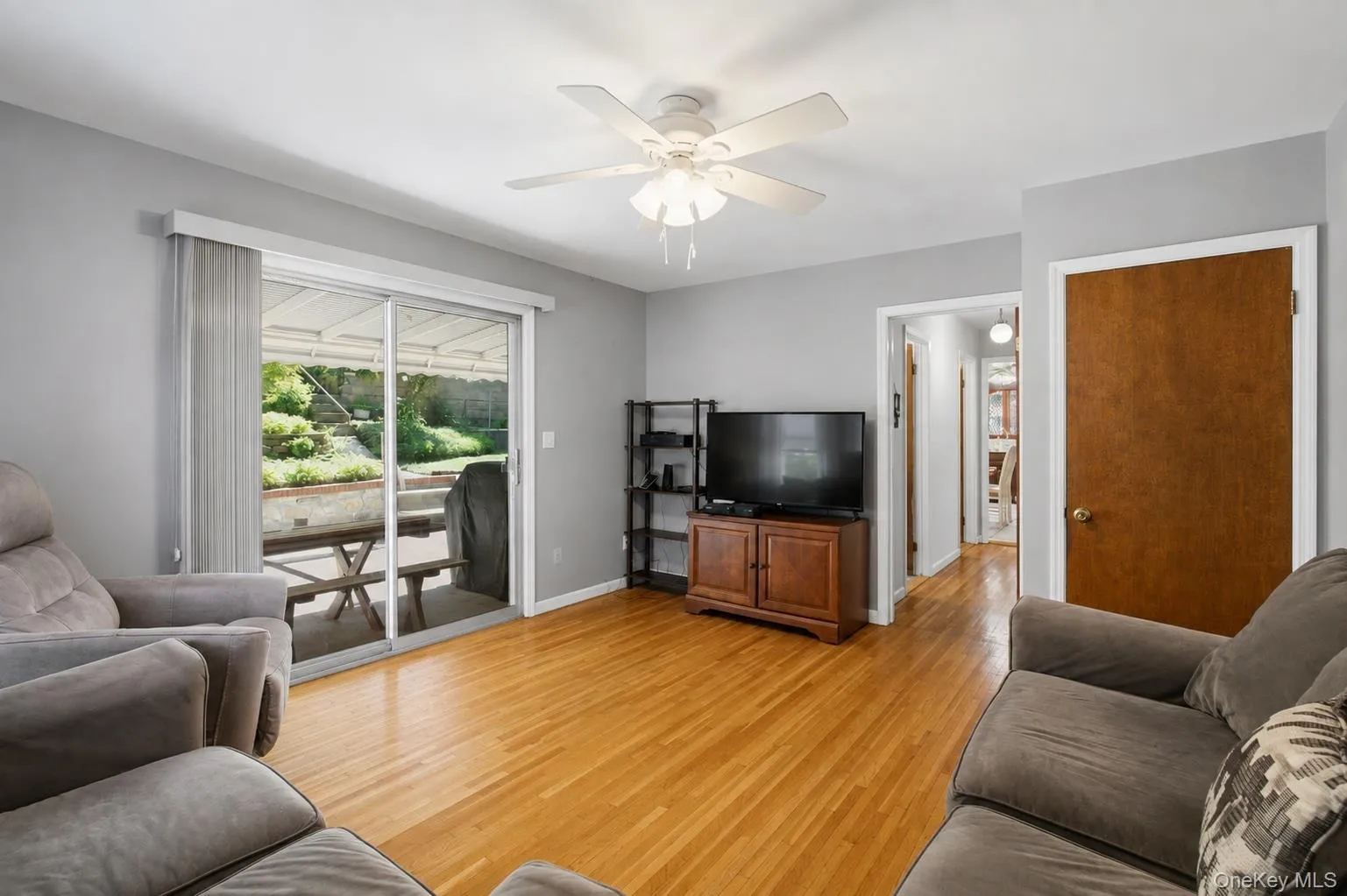 Light-filled den with sliding glass doors leading to the outdoor patio. Light-filled den with sliding glass doors leading to the outdoor patio.