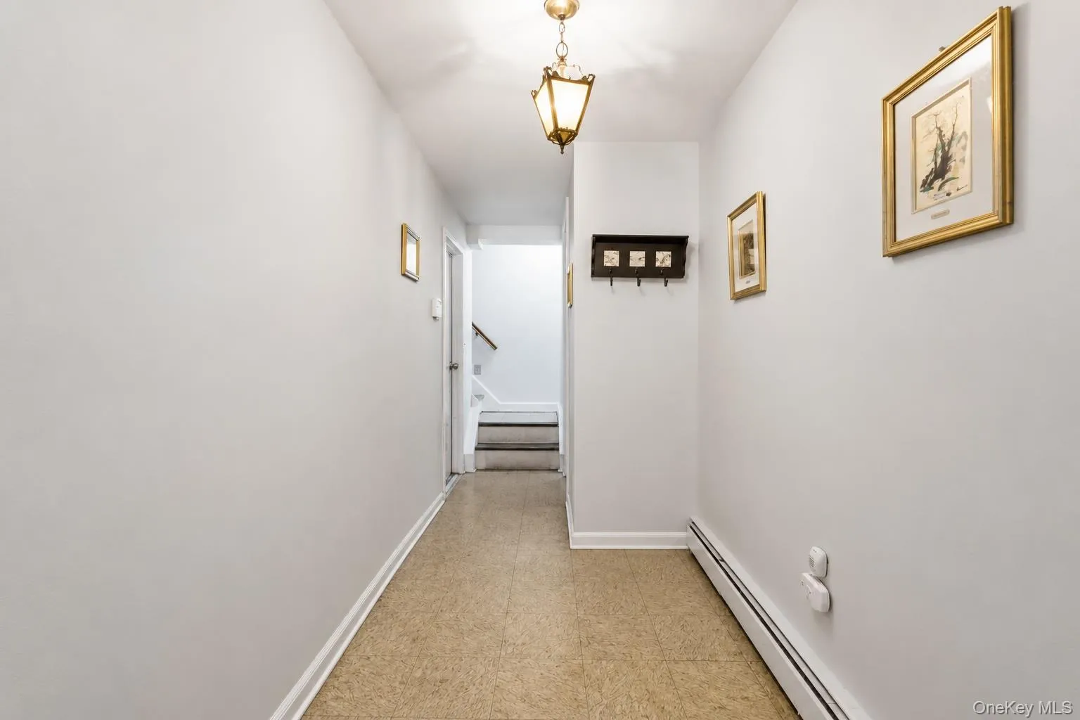 Hallway leading to the versatile recreation space with a convenient private entrance. Hallway leading to the versatile recreation space with a convenient private entrance.