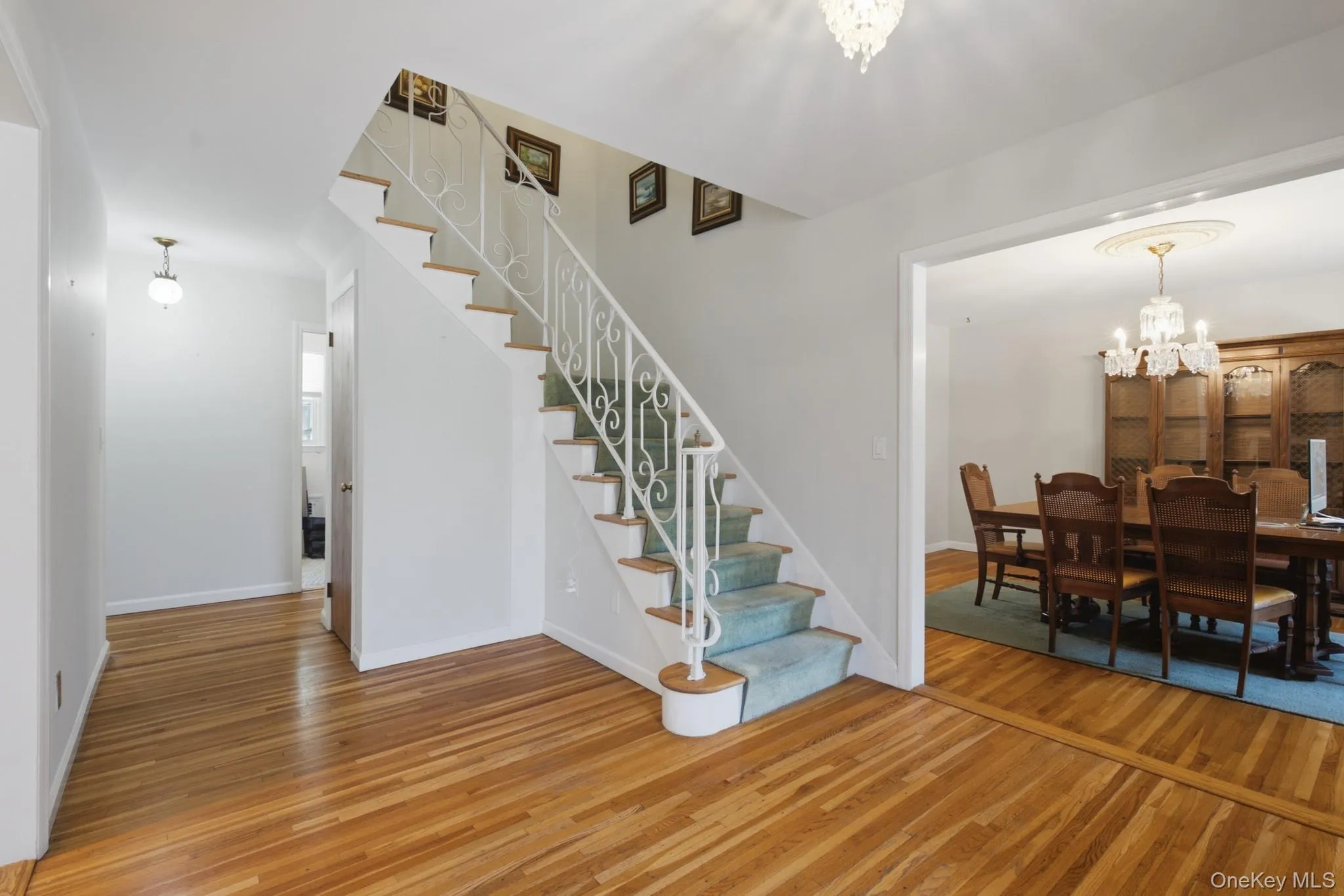 Entrance foyer with stairway leading to the second floor landing Entrance foyer with stairway leading to the second floor landing