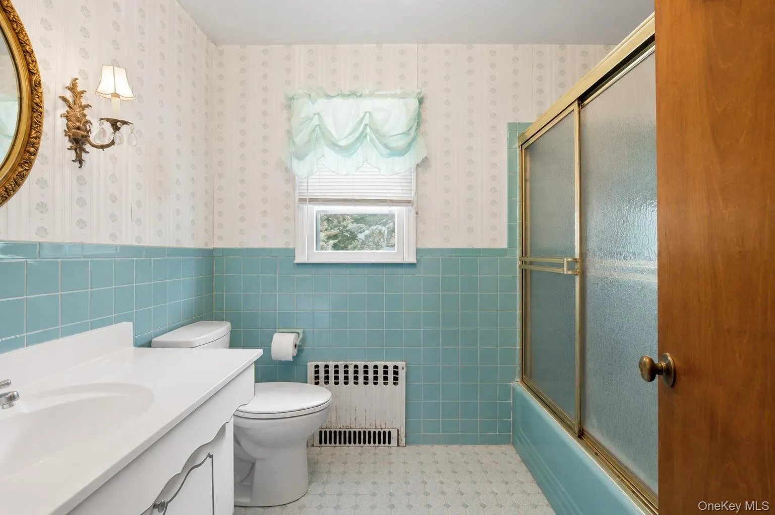 Well-maintained full hall bath featuring classic design and a tub/shower combination. Well-maintained full hall bath featuring classic design and a tub/shower combination.