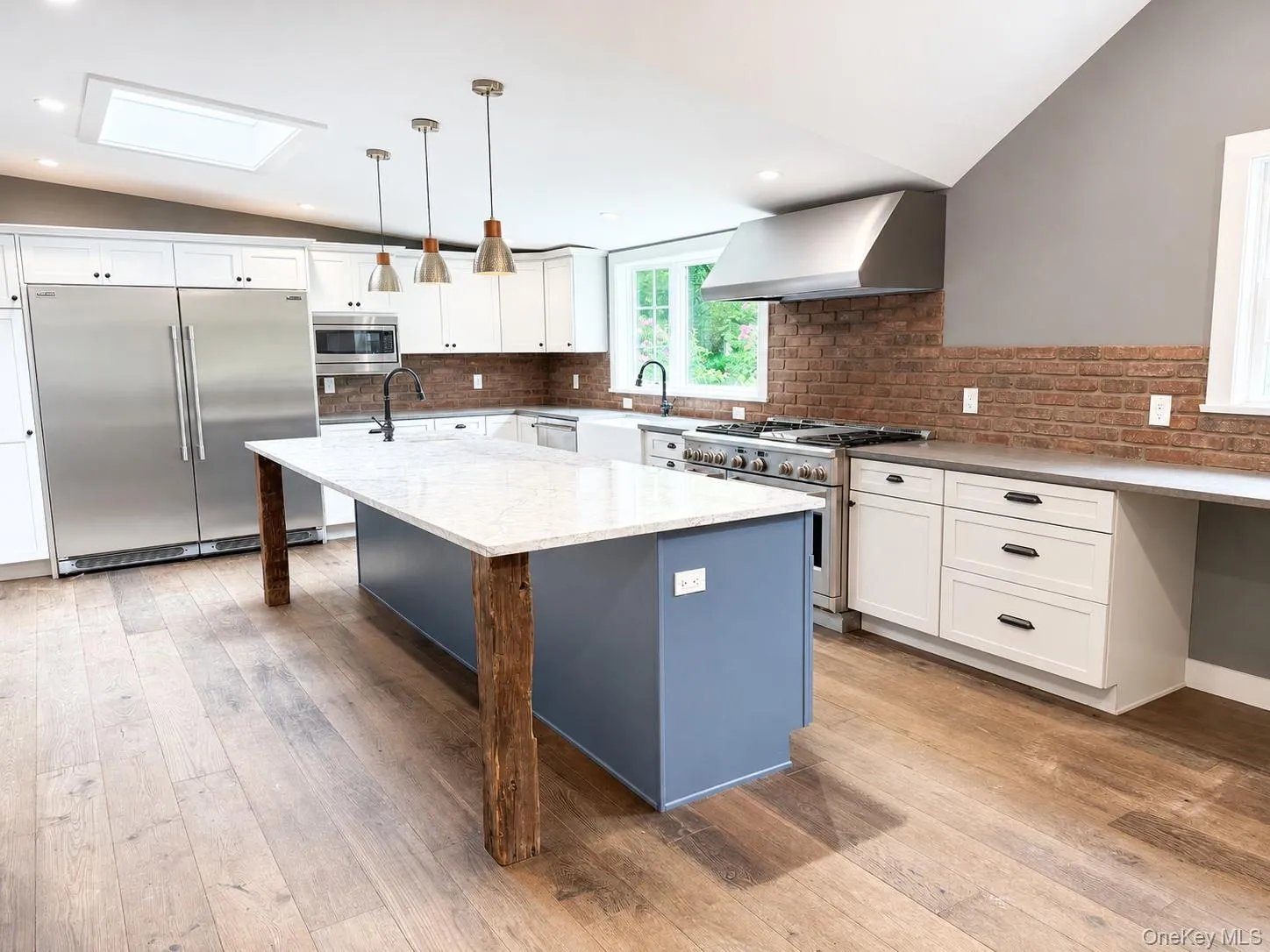 A thoughtfully designed chef's kitchen featuring a built-in side-by-side professional refrigerator, custom shaker cabinetry with crown molding, quartz countertops, integrated microwave, and abundant storage. Every detail combines timeless style with exceptional functionality. A thoughtfully designed chef's kitchen featuring a built-in side-by-side professional refrigerator, custom shaker cabinetry with crown molding, quartz countertops, integrated microwave, and abundant storage. Every detail combines timeless style with exceptional functionality.