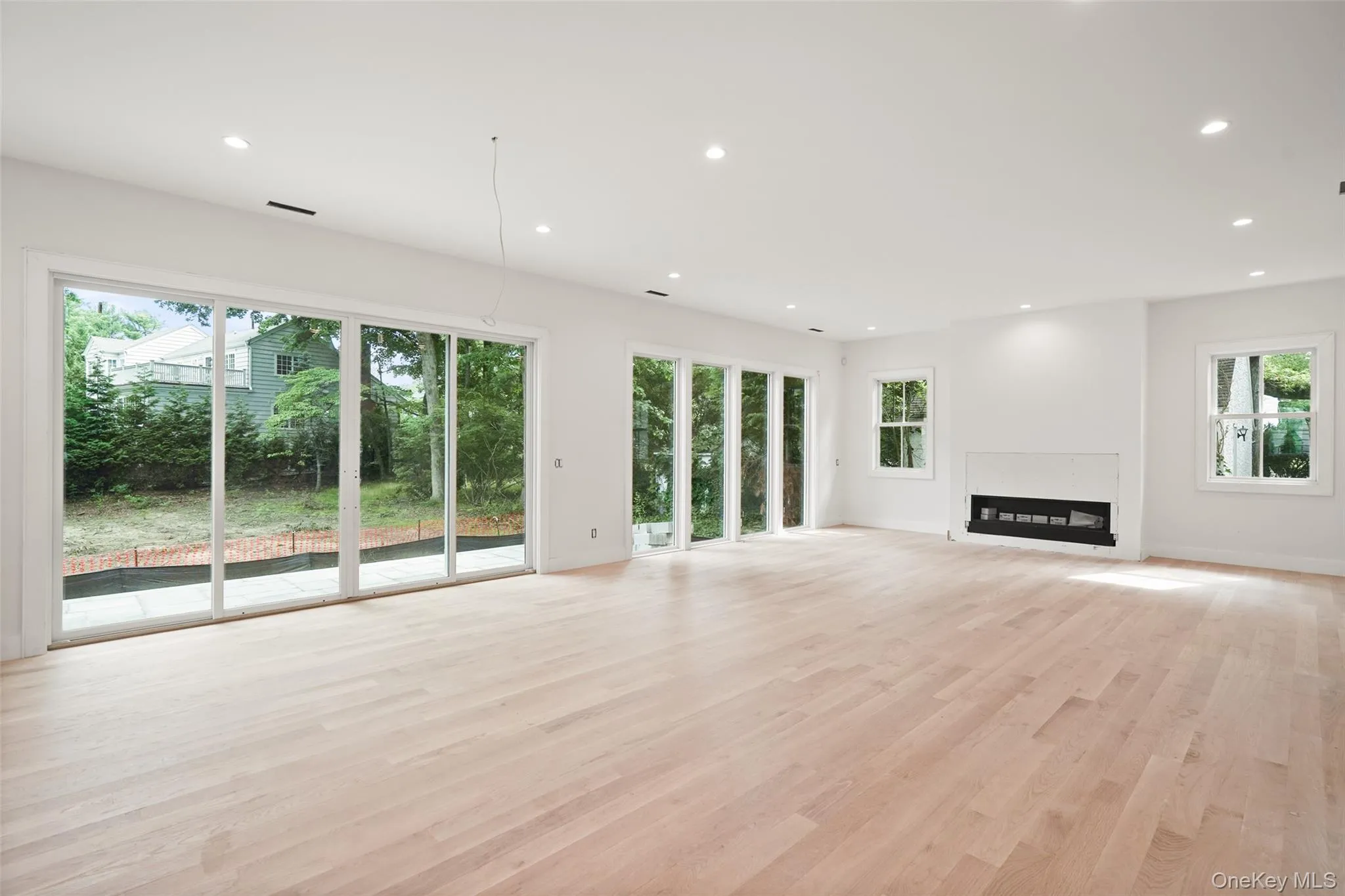 Great room with floor to ceiling windows Great room with floor to ceiling windows