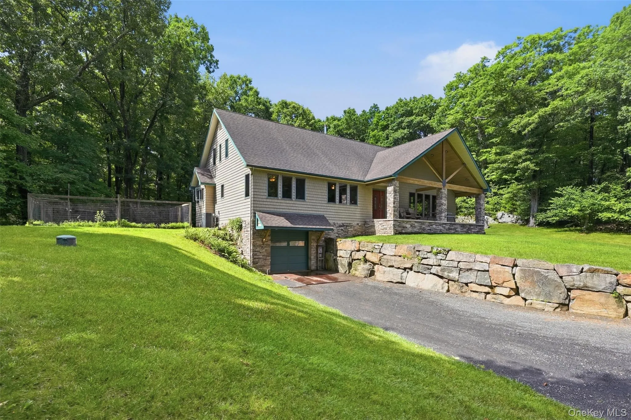 Stone walls gracing the path to an enormous garage, workshop, gym, or artist, musician ,dancer/gymnast studio Stone walls gracing the path to an enormous garage, workshop, gym, or artist, musician ,dancer/gymnast studio
