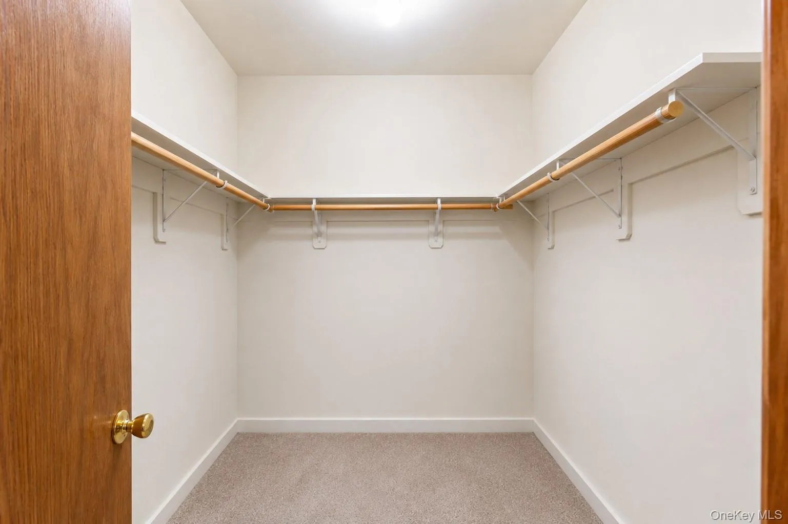 Master bedroom walk-in closet (belongings removed with ai) Master bedroom walk-in closet (belongings removed with ai)