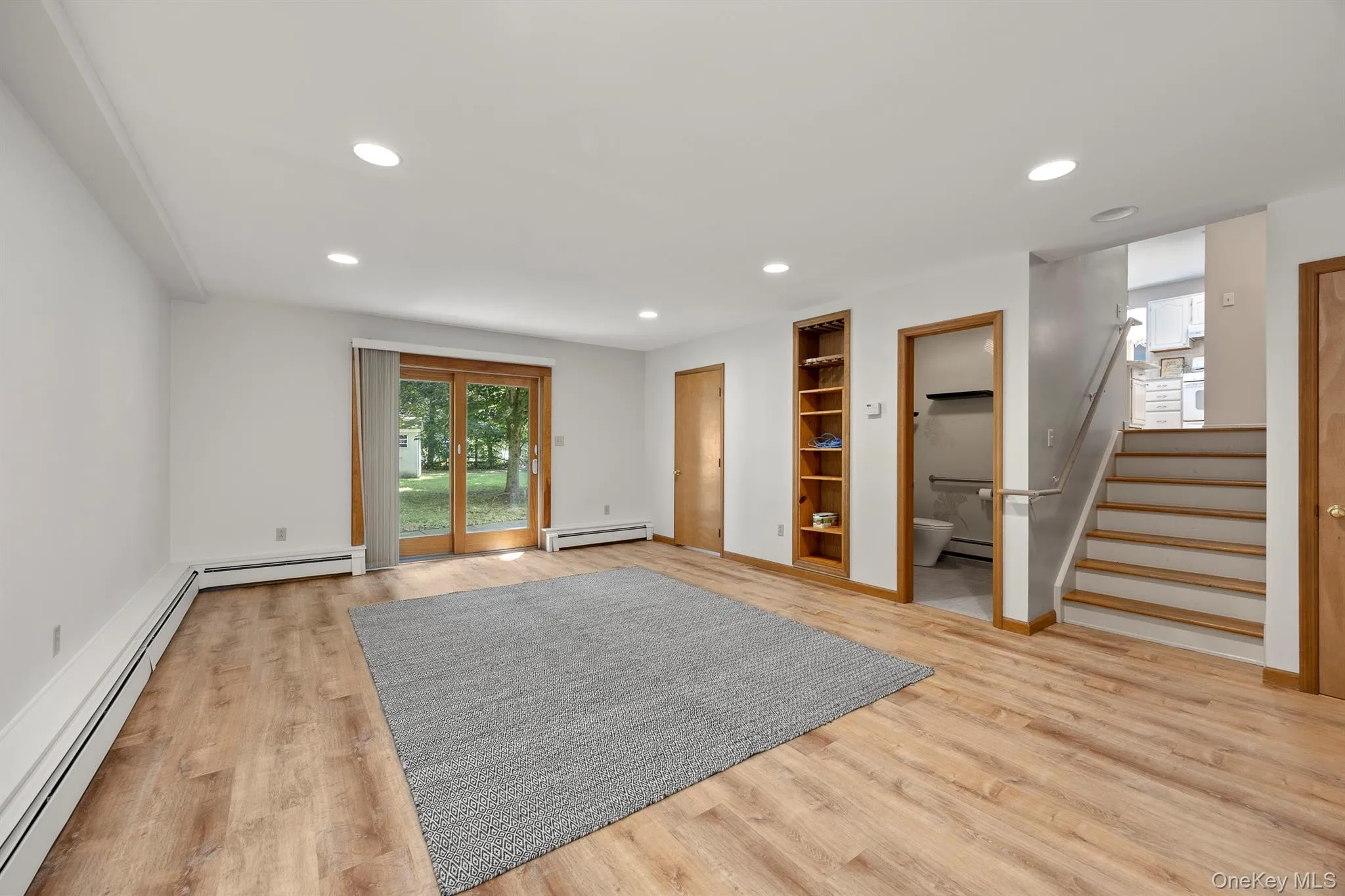 A fabulous very large family room with glass doors with easy access to the backyard A fabulous very large family room with glass doors with easy access to the backyard