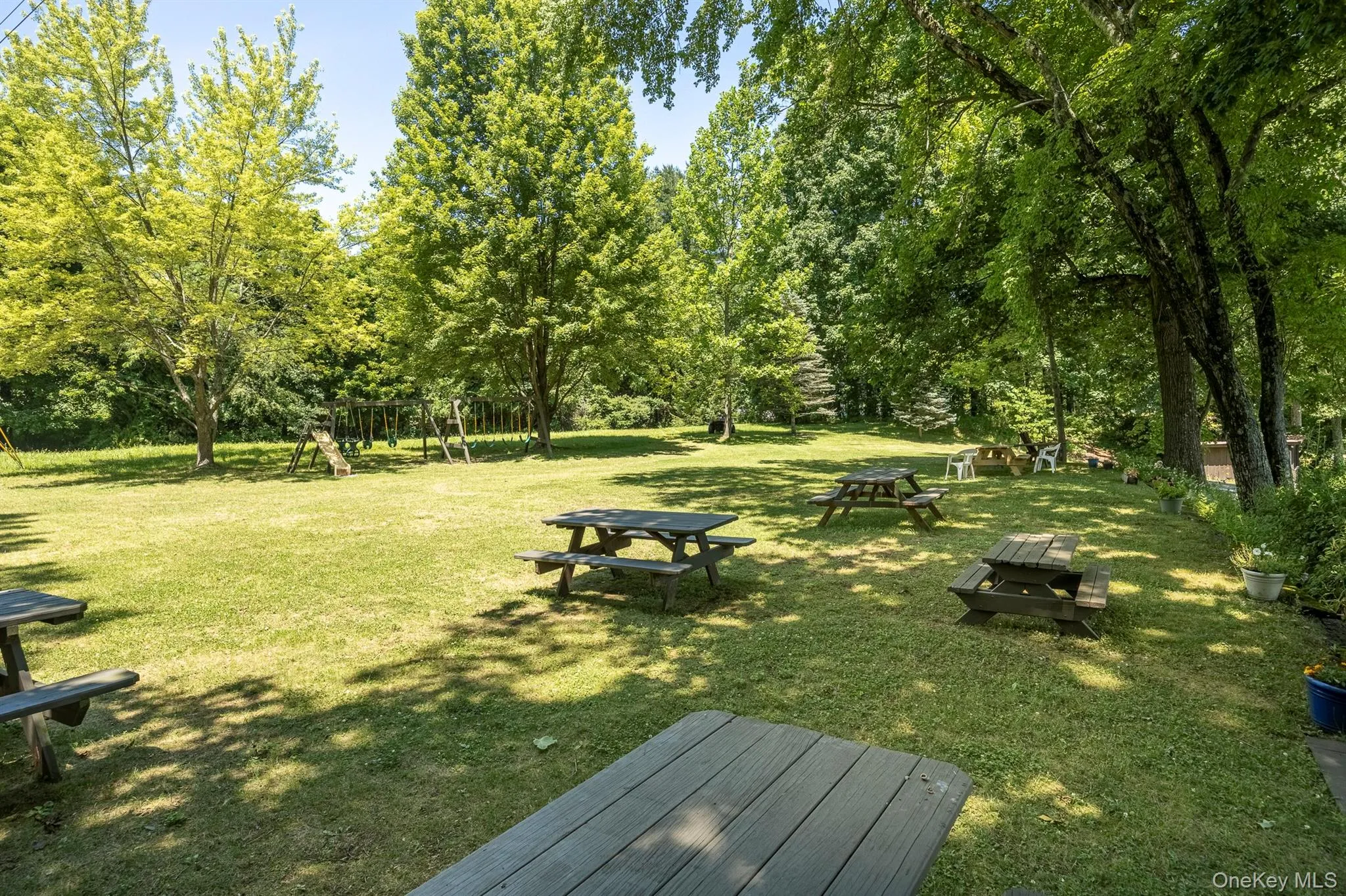 This wonderful park-like area with grills & picnic tables is for residents use This wonderful park-like area with grills & picnic tables is for residents use