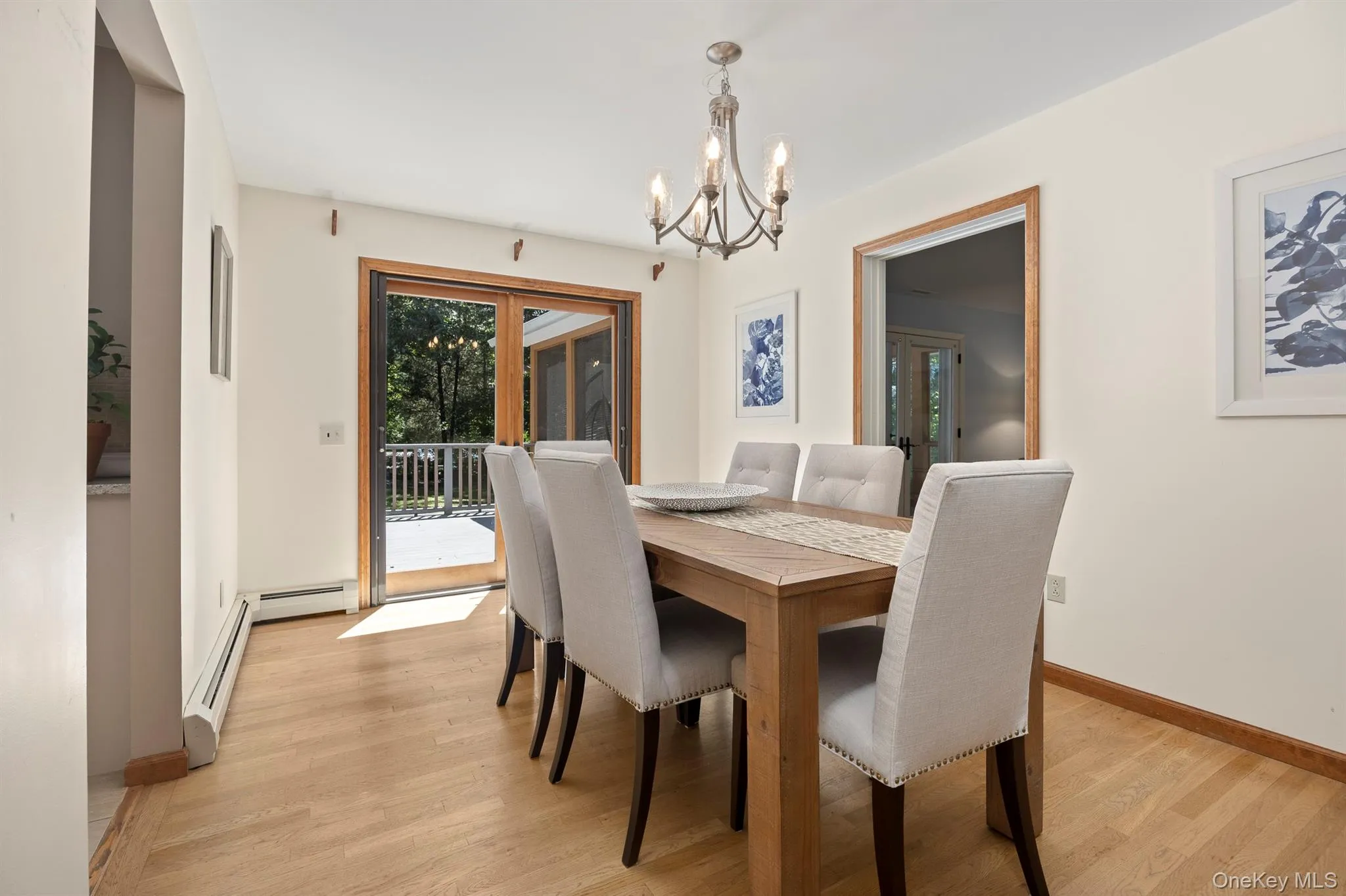 Glass doors lead from the dining room to the deck Glass doors lead from the dining room to the deck