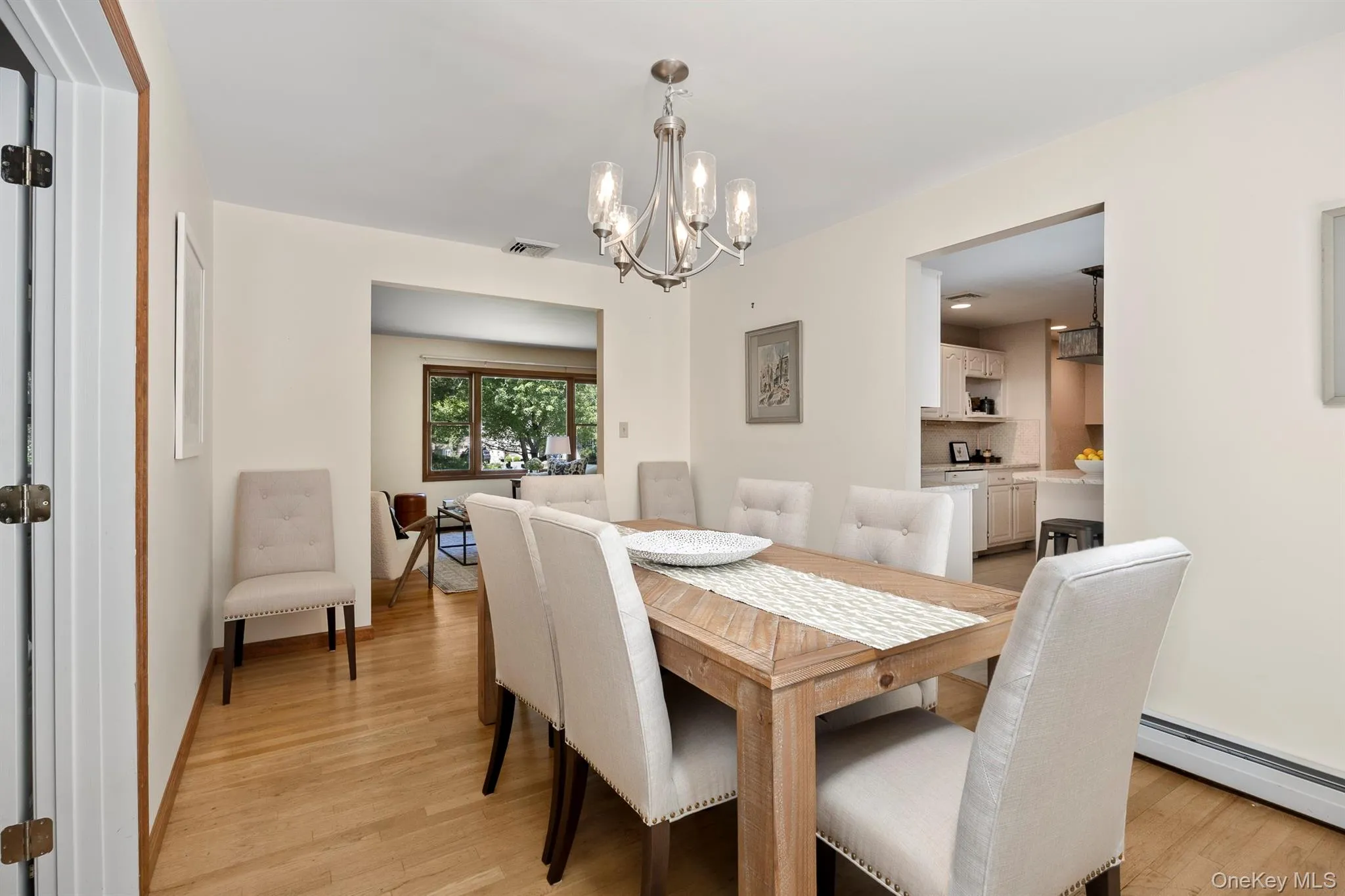 The wide openings between living room, kitchen & dining room gives the floor plan an open feel The wide openings between living room, kitchen & dining room gives the floor plan an open feel