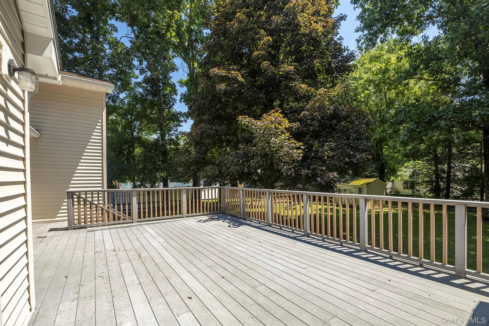 The open deck off of the kitchen and dining room is a wonderful place to entertain or just relax The open deck off of the kitchen and dining room is a wonderful place to entertain or just relax