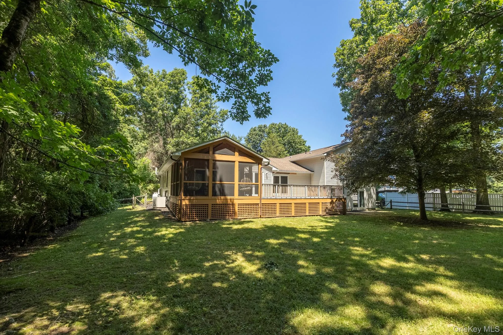 The fabulous deck, partly screened in and partly open makes a great entertaining space The fabulous deck, partly screened in and partly open makes a great entertaining space