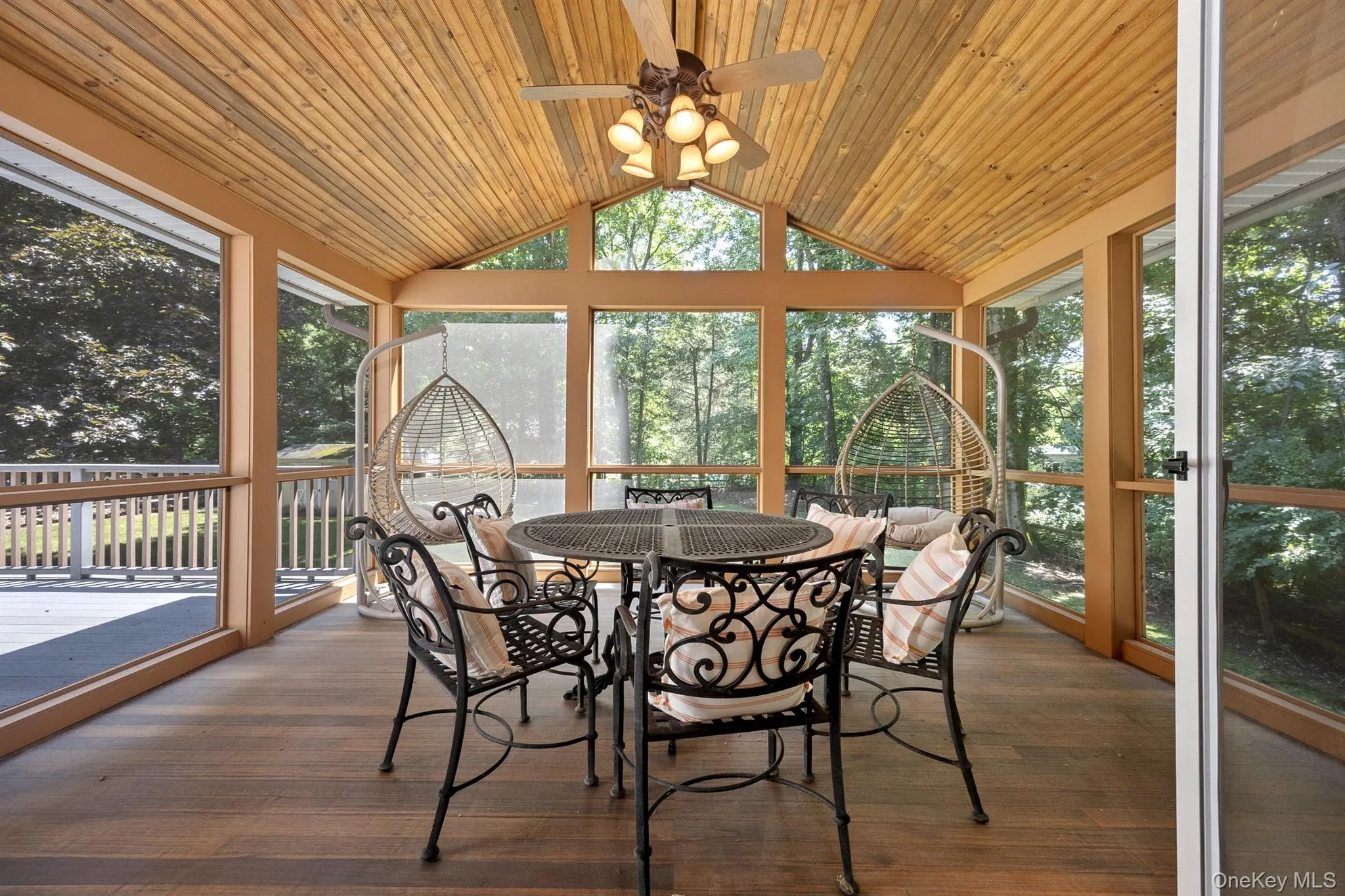 This beautiful screened in area is perfect for dining or just relaxing This beautiful screened in area is perfect for dining or just relaxing