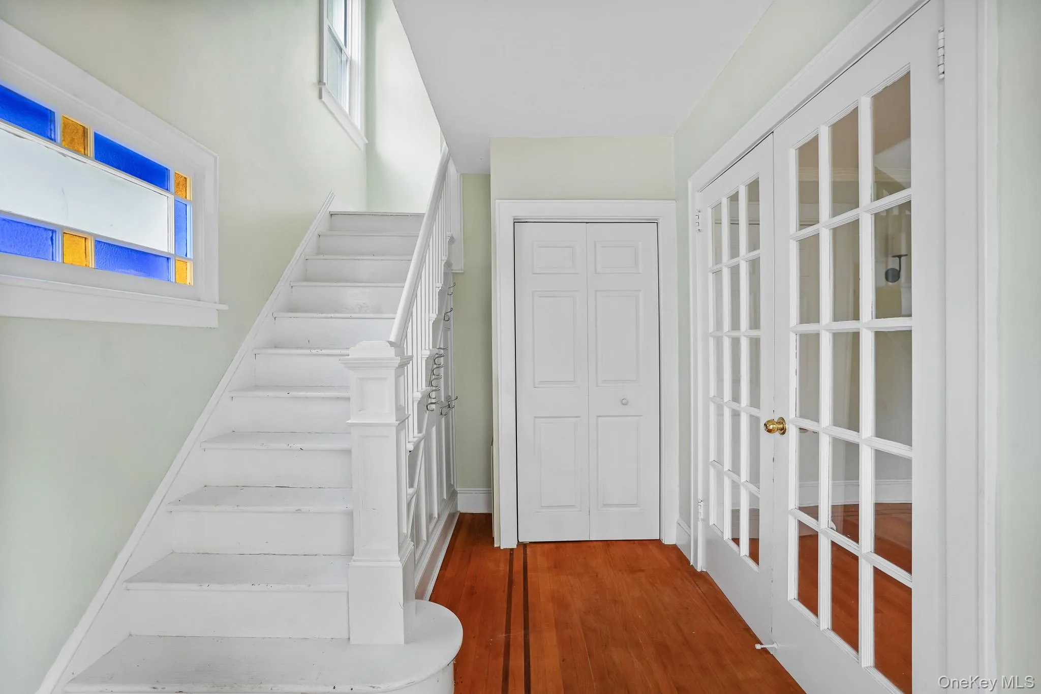 Main entry with access to living room to the right through French doors Main entry with access to living room to the right through French doors