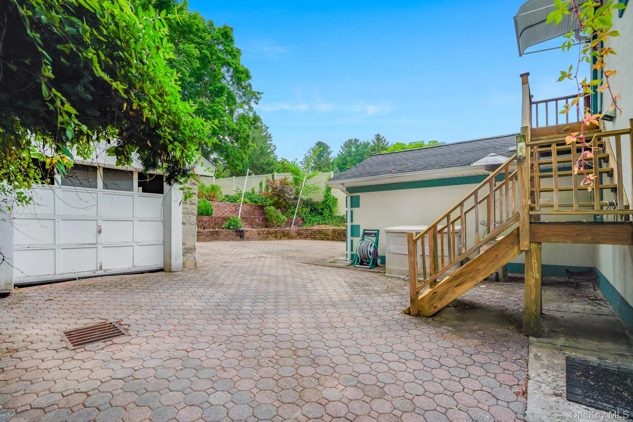 Showing staircase with access to second floor from the patio Showing staircase with access to second floor from the patio