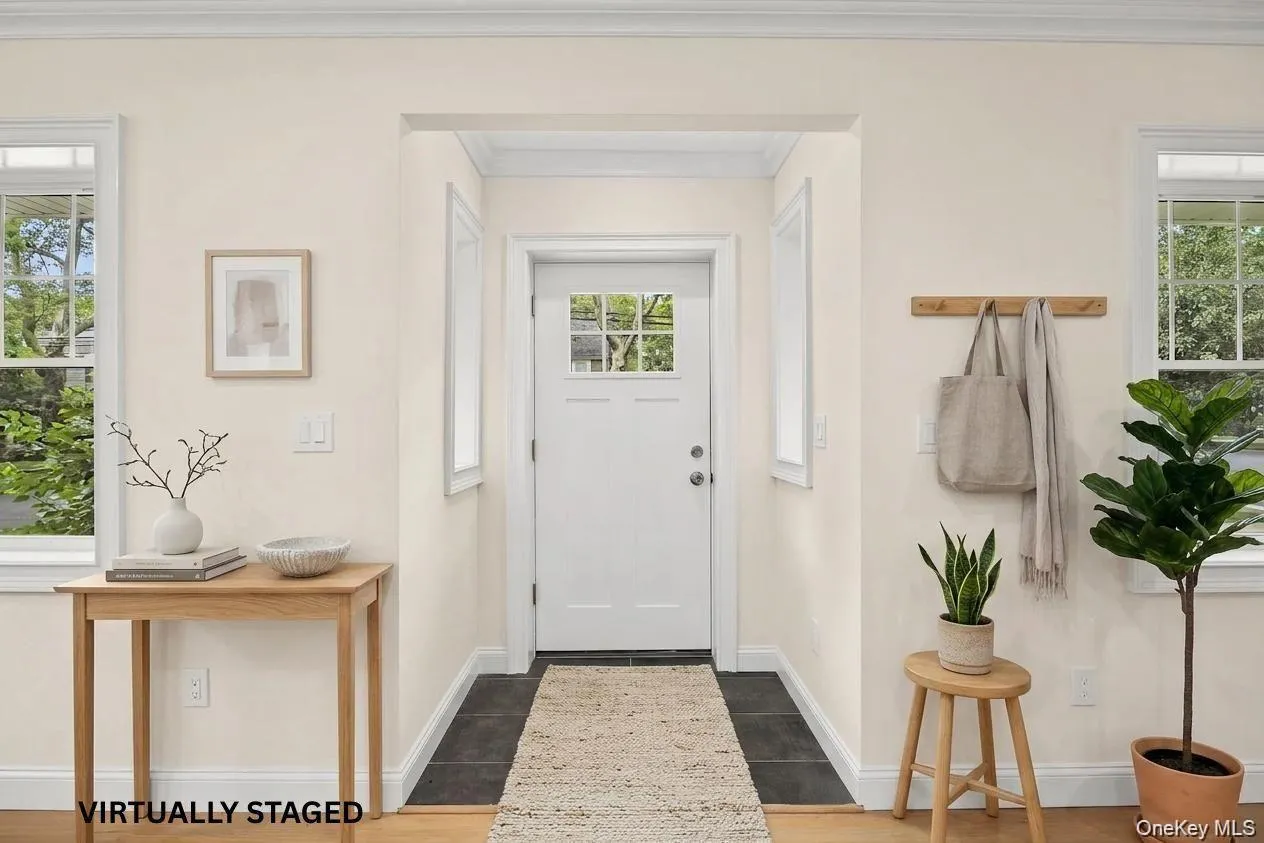 front foyer, virtually staged. front foyer, virtually staged.