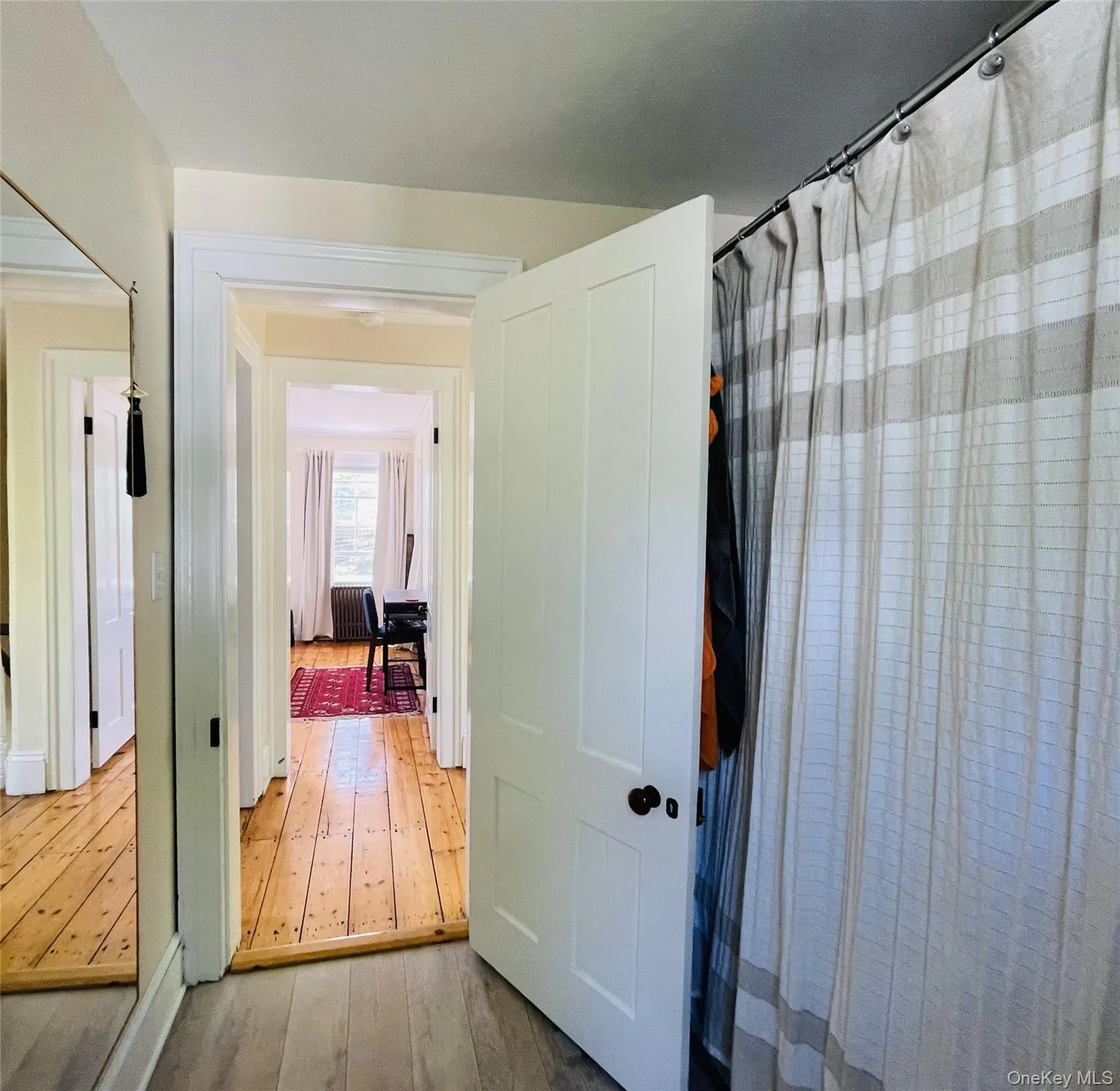 Corridor with hardwood flooring Corridor with hardwood flooring