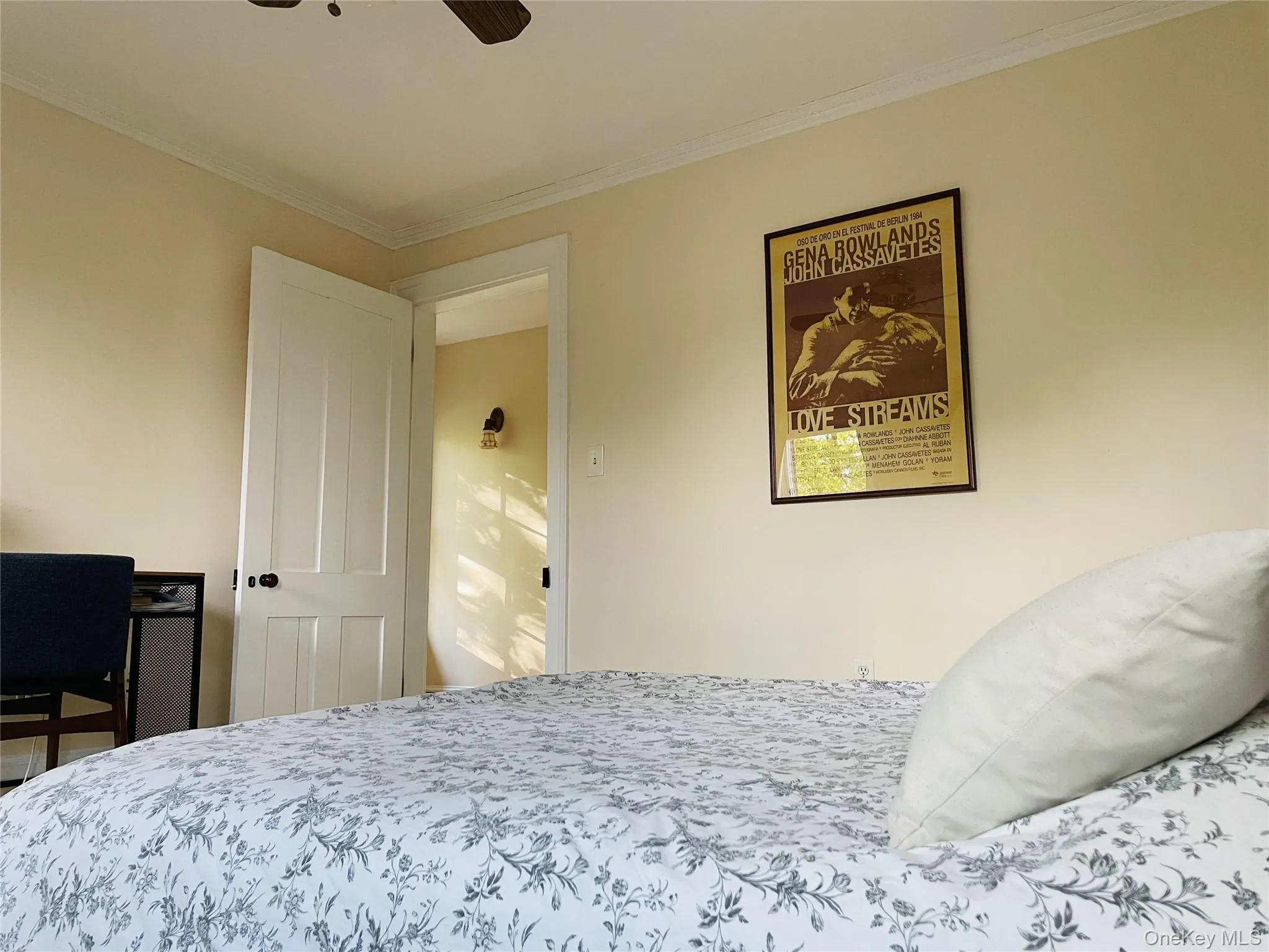 Bedroom featuring crown molding and ceiling fan Bedroom featuring crown molding and ceiling fan