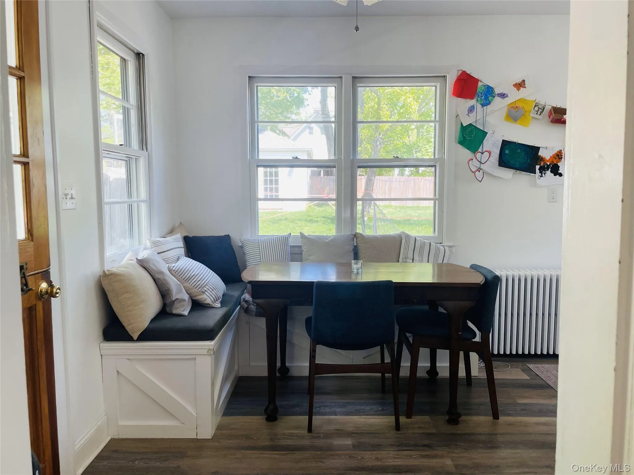 Dining area featuring wood floors Dining area featuring wood floors