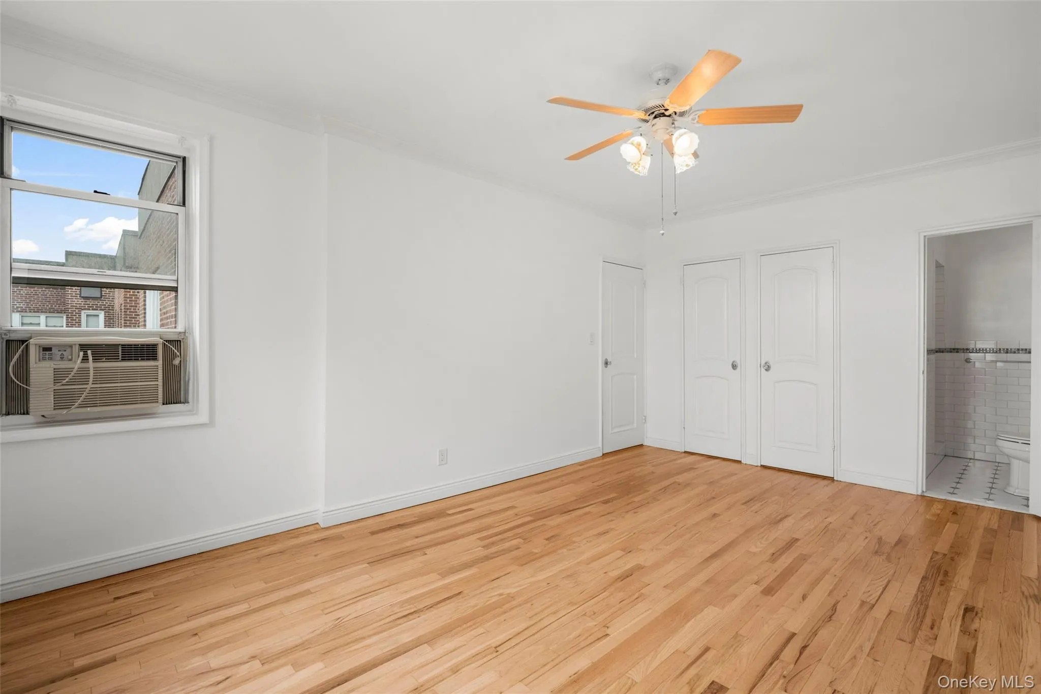 Bathed in natural light from two exposures, the primary suite offers a large walk-in closet and a private en-suite bath with a walk-in shower. Bathed in natural light from two exposures, the primary suite offers a large walk-in closet and a private en-suite bath with a walk-in shower.