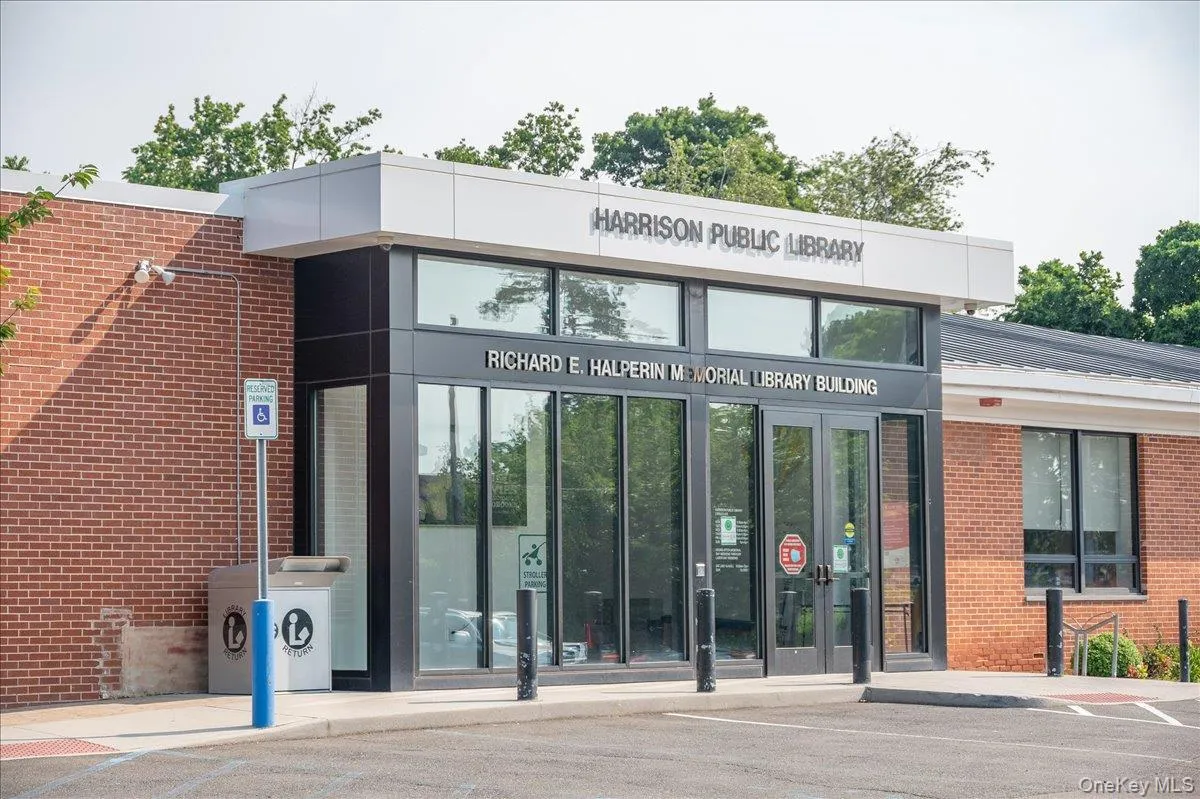 Brick building with a contemporary glass and metal facade entrance Brick building with a contemporary glass and metal facade entrance