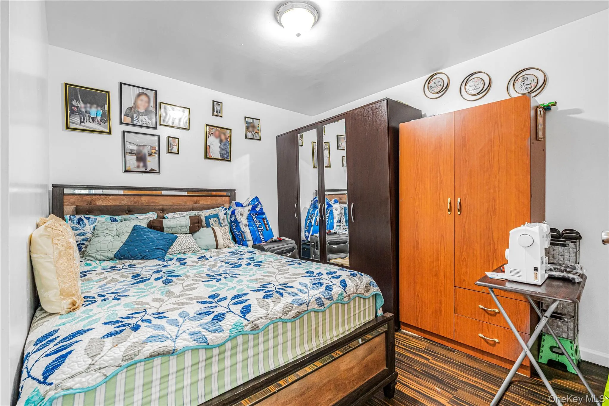 White walls complement the dark wood-finish flooring White walls complement the dark wood-finish flooring