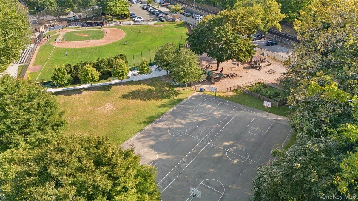 Outdoor basketball court with painted lines and two hoops Outdoor basketball court with painted lines and two hoops