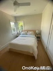 Bedroom featuring baseboards and a ceiling fan Bedroom featuring baseboards and a ceiling fan