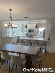 Dining area with wood finished floors Dining area with wood finished floors
