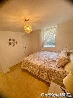 Carpeted bedroom featuring baseboards Carpeted bedroom featuring baseboards