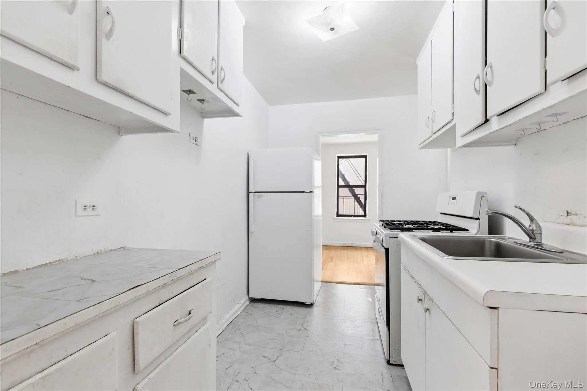 Large windowed kitchen leads to dining area Large windowed kitchen leads to dining area