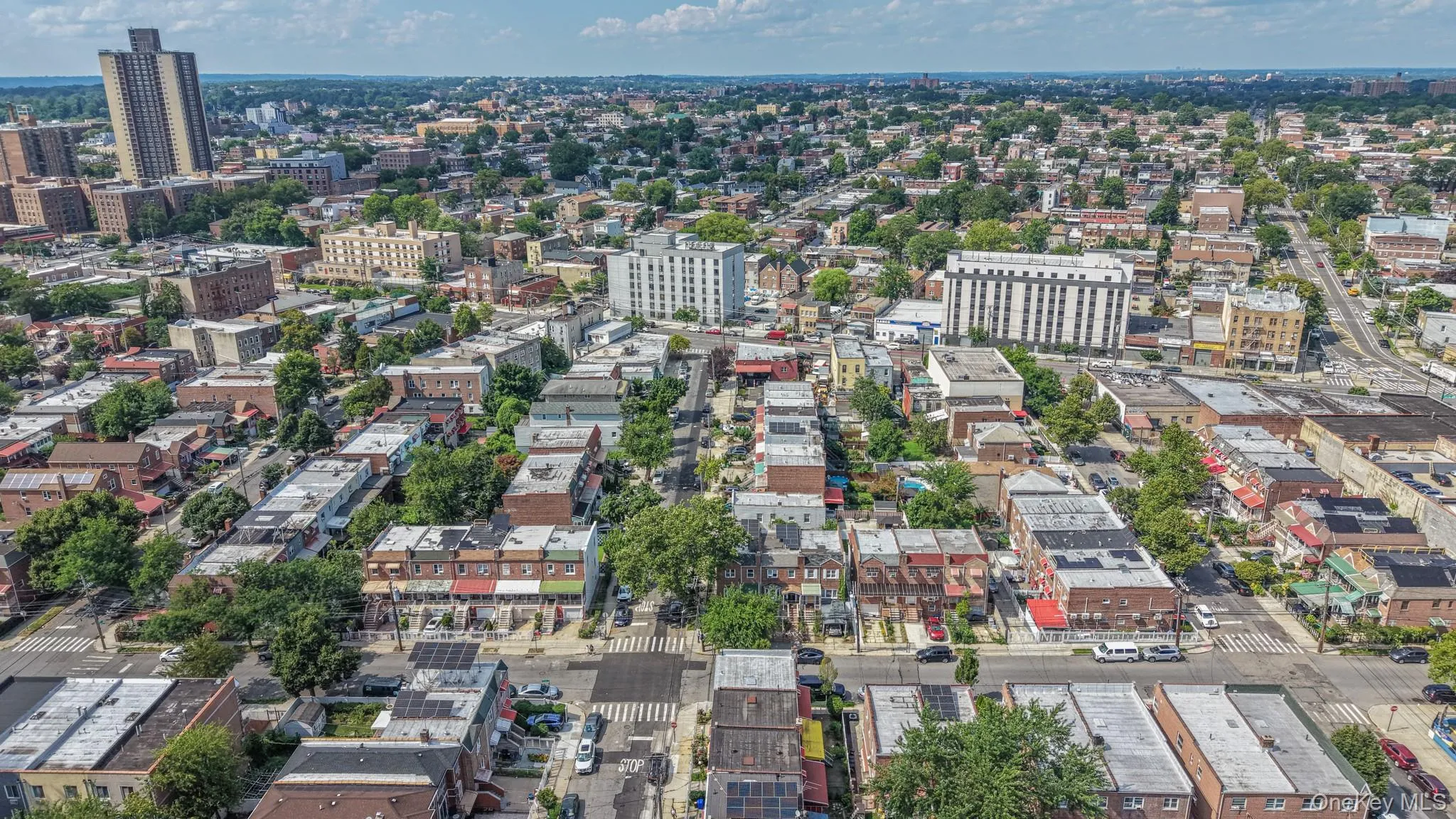 Aerial perspective showcasing a diverse urban landscape with residential and commercial buildings Aerial perspective showcasing a diverse urban landscape with residential and commercial buildings