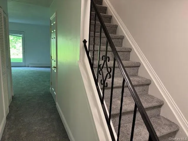 Staircase with carpeting bringing you to the second floor bedroom area... Staircase with carpeting bringing you to the second floor bedroom area...