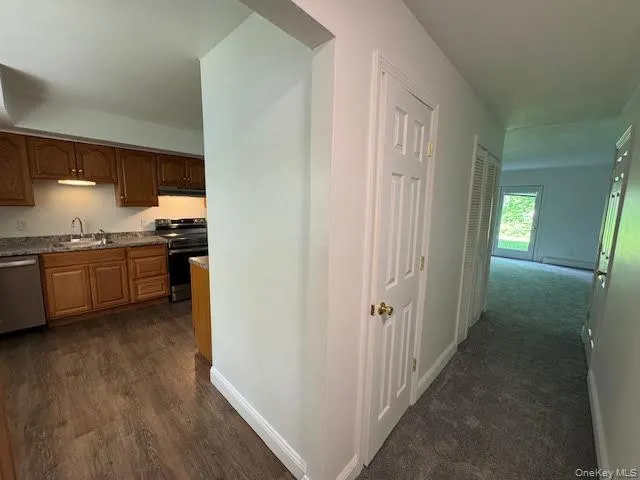 Main entry way with a view of the kitchen to the left and straight view of the living room. Main entry way with a view of the kitchen to the left and straight view of the living room.