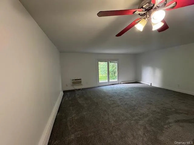 Open floor plan dining and living room with a slider opening to a concrete patio and back level green yard... Open floor plan dining and living room with a slider opening to a concrete patio and back level green yard...